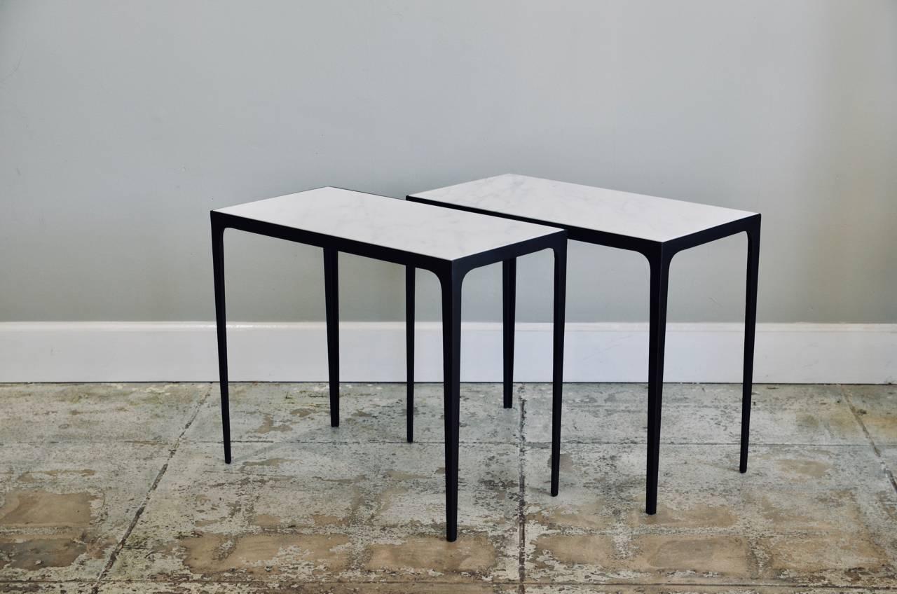 Pair of 'Esquisse' iron and honed marble side tables by Design Frères. 