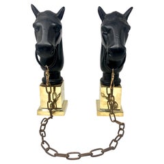 Pair of Estate Wrought Iron Horse Head "Chenets" with Brass Bases.