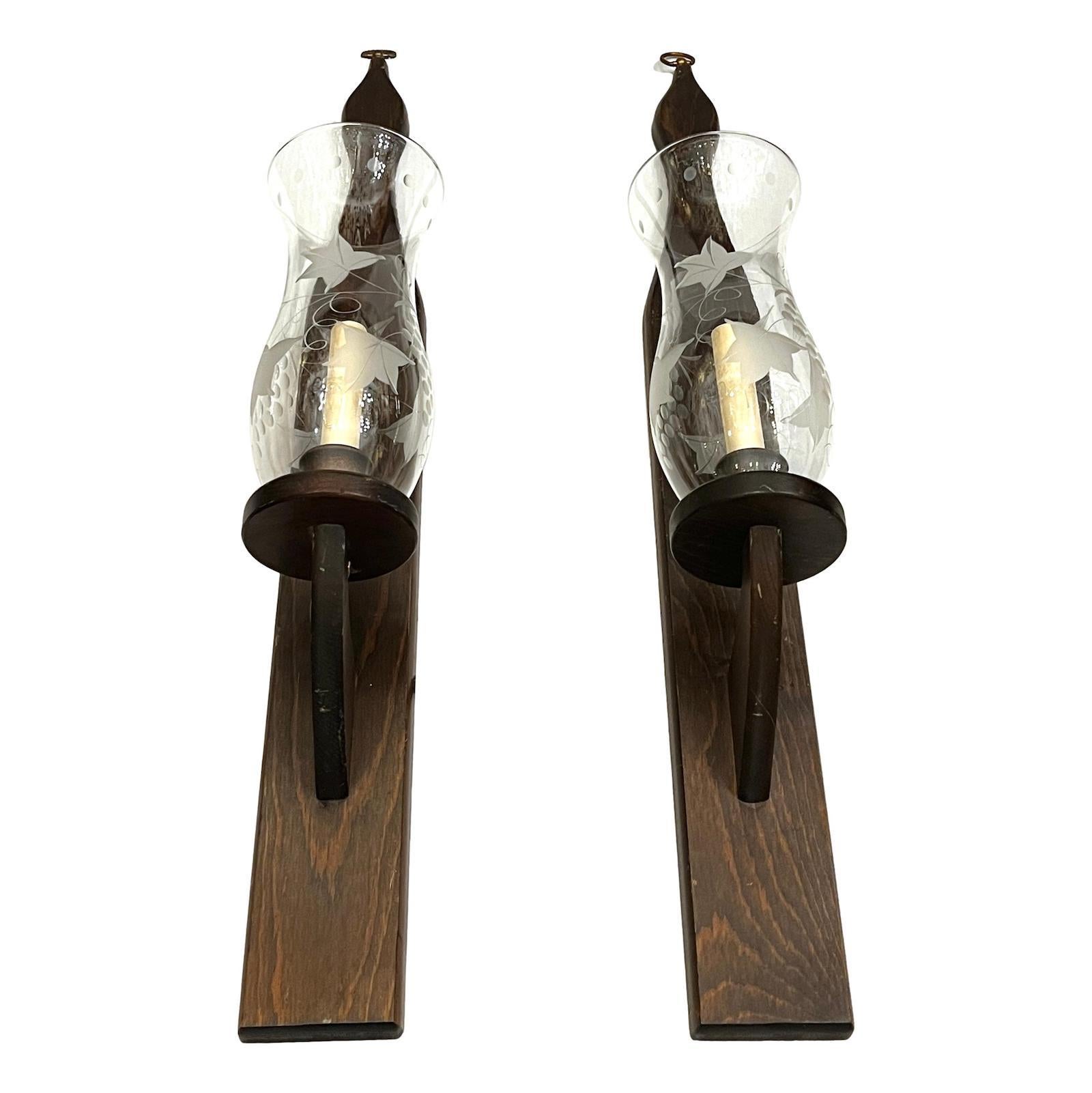 Pair of Italian circa 1950s single-light wood sconces with etched glass hurricanes.

Measurements:
Height: 31