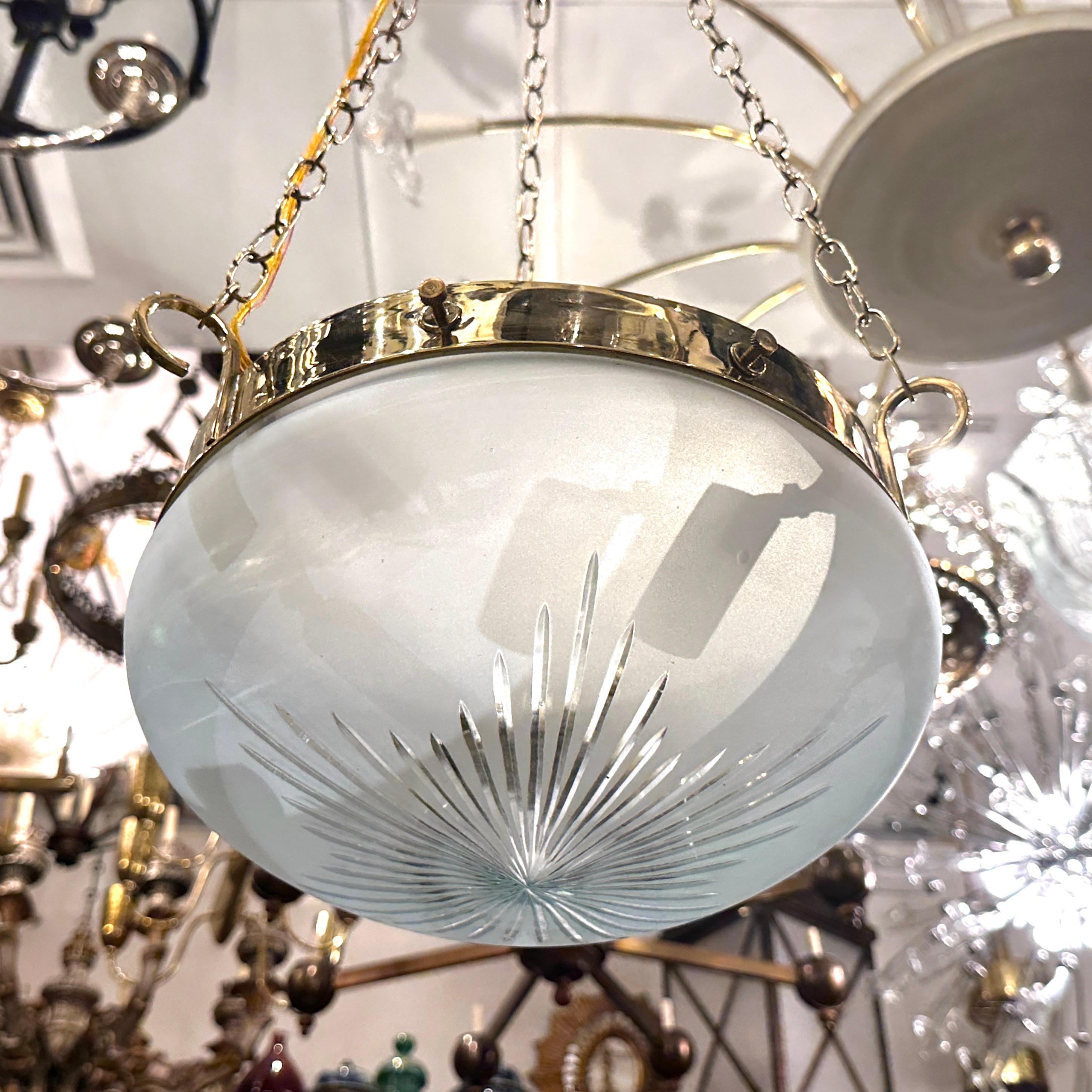 Pair of 1950's frosted and etched glass light fixtures with 3 interior lights. Sold Individually.

Measurements:
Current drop: 29