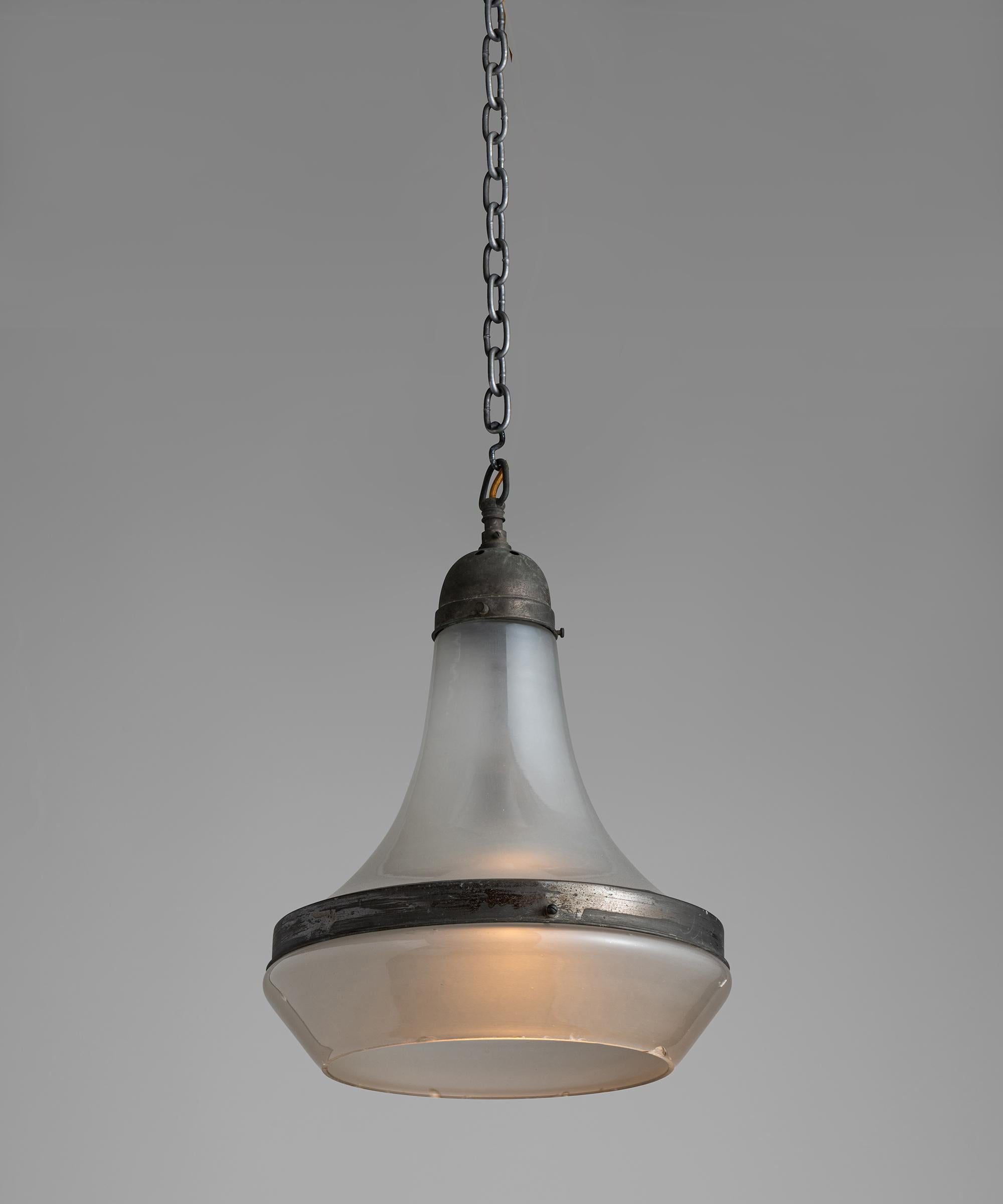 Pair of etched glass pendants

Germany, Circa 1930

Tapered glass upper with lower etched glass open shade, secured with steel binding and gallery with original dark patina.