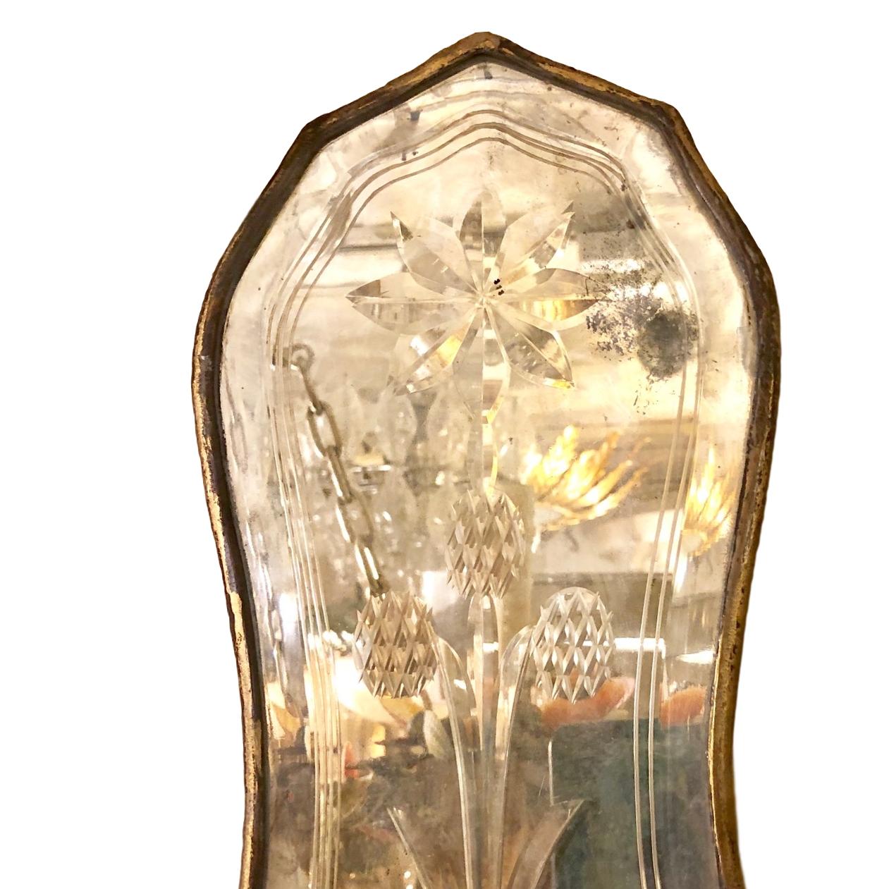 Pair of 1920s English etched glass double light sconces with gilt and patinated finish.

Measurements:
Height 18?
Width 8.5?
Depth 5?.