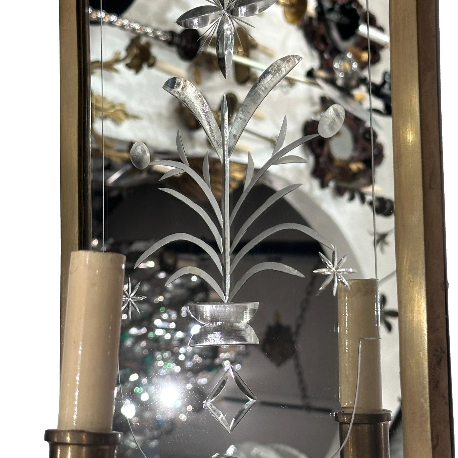Pair of circa 1950's English mirrored sconces with etched foliage decoration.

Measurements:
Height: 22.5”
Width: 9