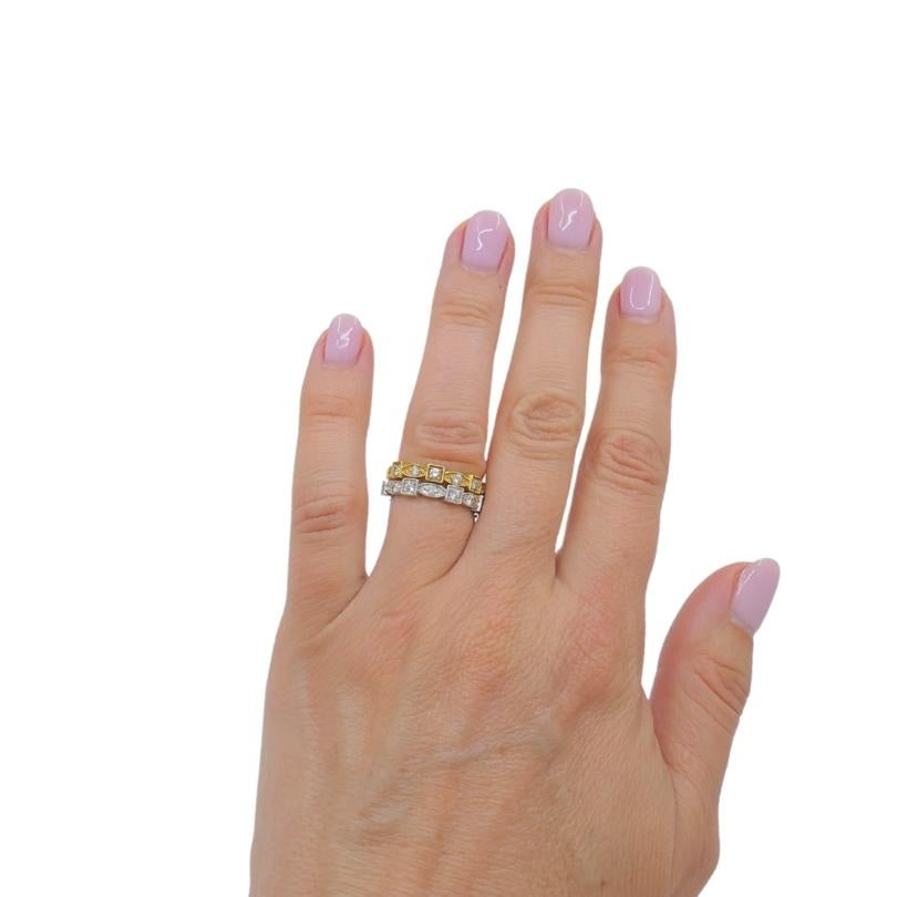 

A pair of eternity rings, one is made of 18k white gold, the other of 18k yellow gold. Both feature a repeating sequence of alternating square and marquise shaped settings, each holding a round diamond. Together, the shapes work well to create a