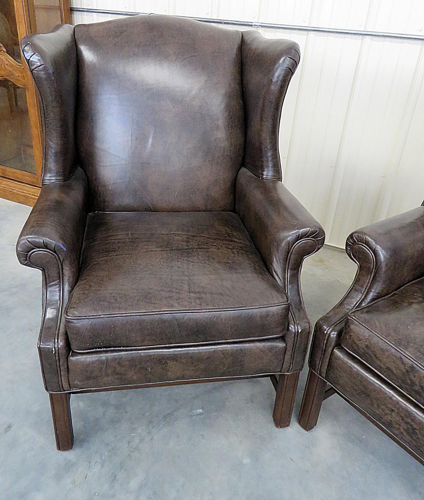 Pair of Ethan Allen leather upholstered wingback chairs.