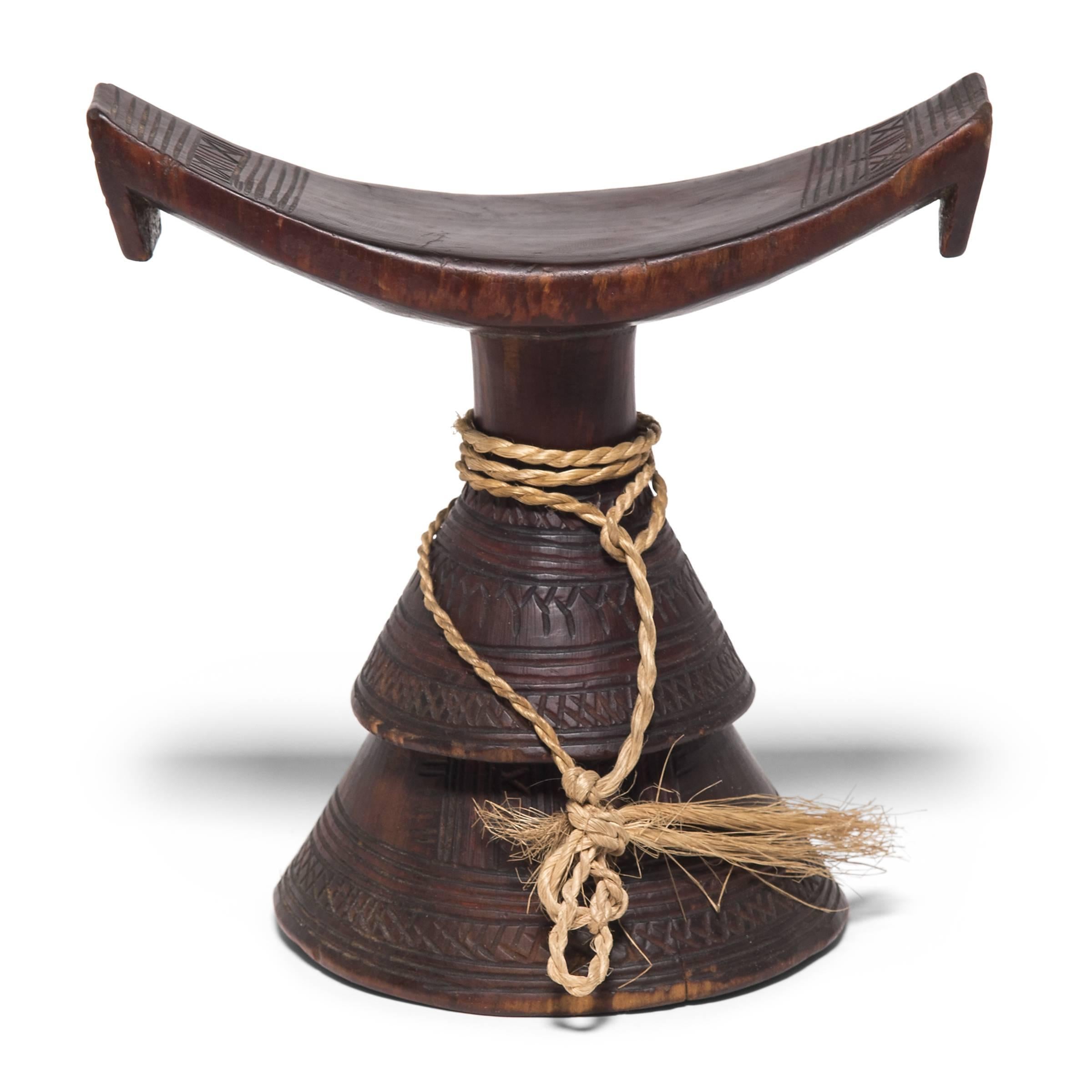 So as not to muss their intricate hairstyles, tribal leaders would rest their heads on these petite wooden stands. The combination of conic base and concave rest gives these functional items an elevated sense of artistry. Intricately detailed and