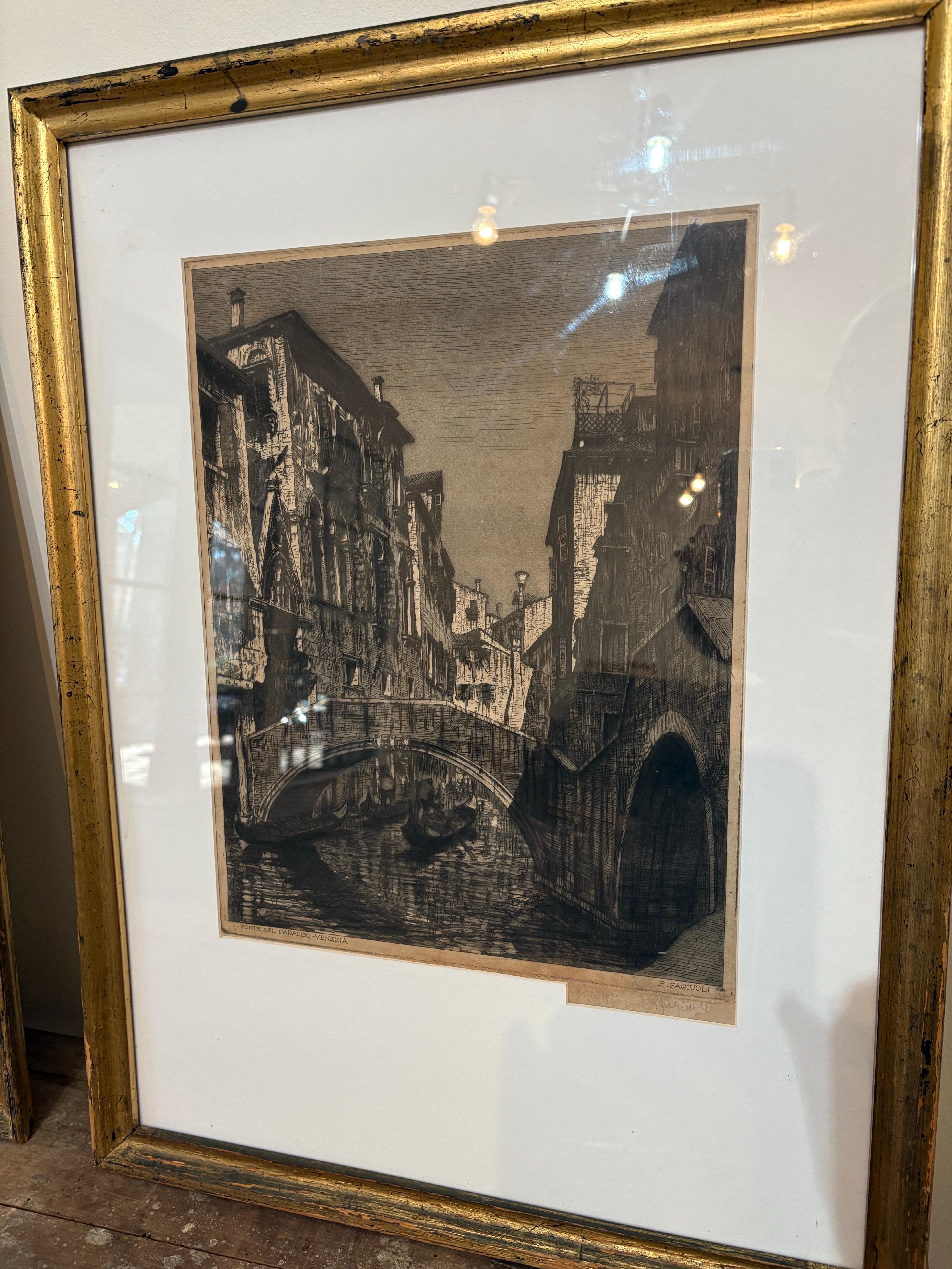 A pair of signed etchings dated 1926 by Italian artist Ettore Fagiuoli.  Beautifully matted in off-white and set in a gilded frame.  Each etching captures the artist's unique perspective of Verona, Italy and Venice Italy. Though the etchings