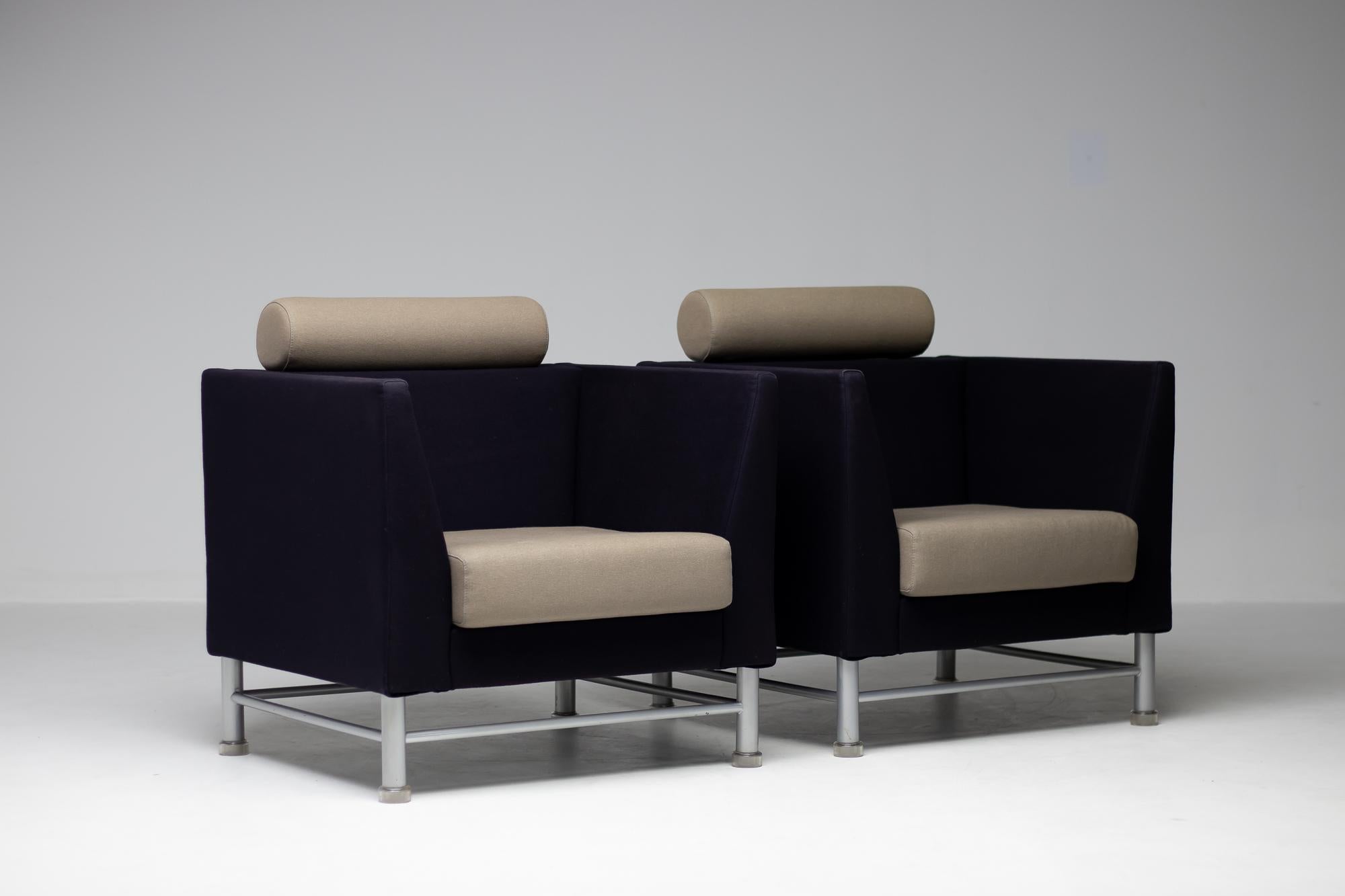 East side lounge chairs designed by Ettore Sottsass for Knoll International in 1983.
Postmodern chairs with original upholstery in nice vintage condition.
The chairs features a gray enameled steel base with translucent plastic feet.
The pair will