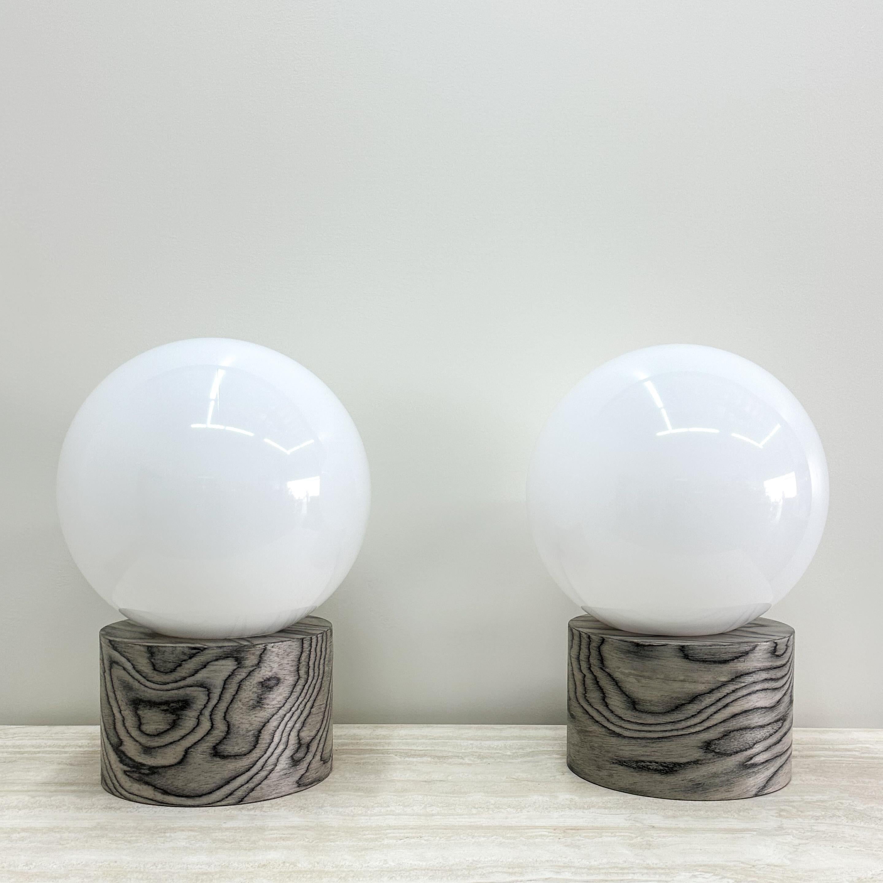 Pair of Ettore Sottsass Veneer & Acrylic Globe Lamps.

The lamps are newly made and have been veneered with the original ALPI veneer, designed by Ettore Sottsass. The veneer has been sealed with a satin finish to enhance durability. The lamps are a
