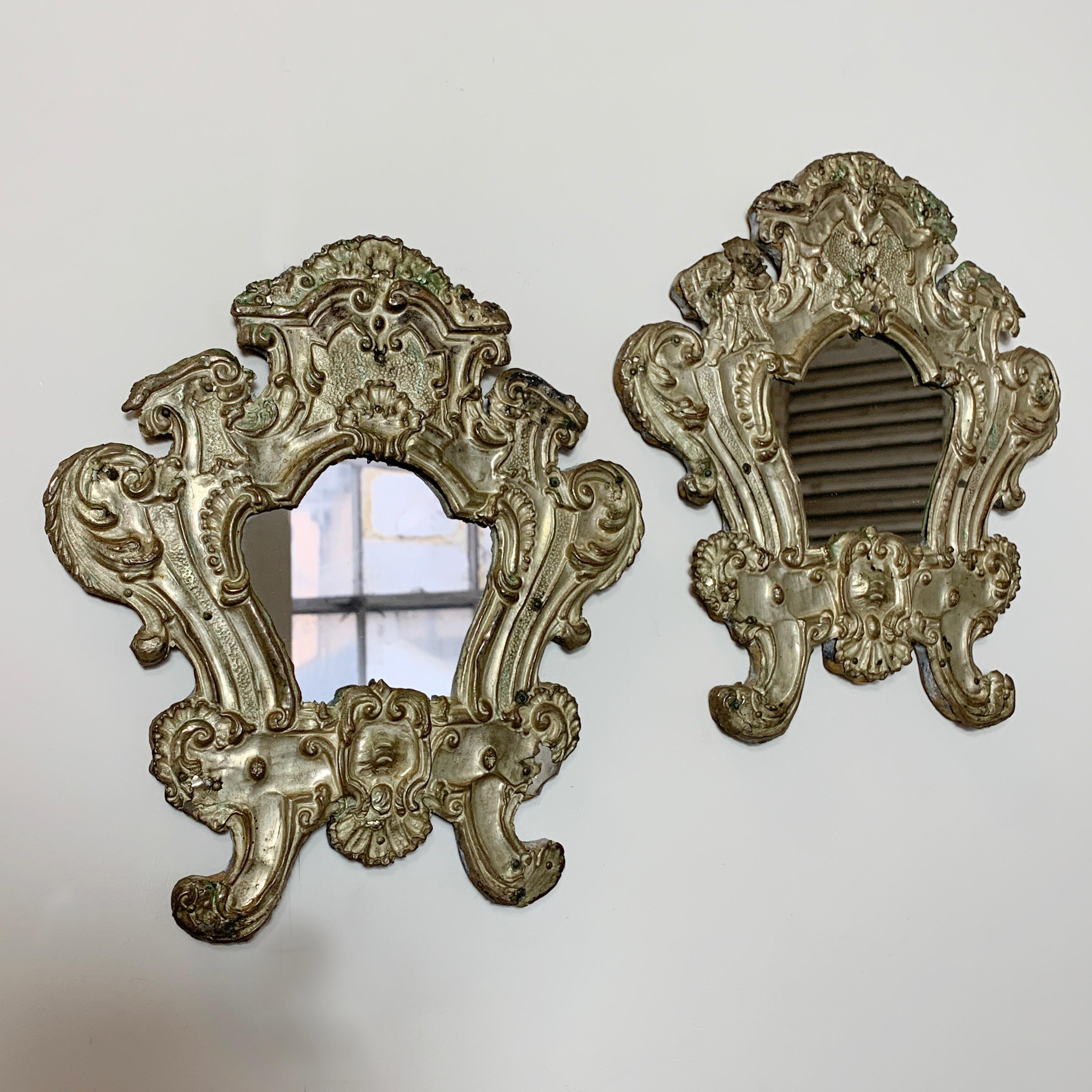 Pair of European 18th century silver plated Baroque mirrors
circa 1725
Beautiful and unique antique handcrafted pieces
The carved wooden frame is covered with silver plated hand beaten copper
Hand beaten copper has been crafted in a decorative