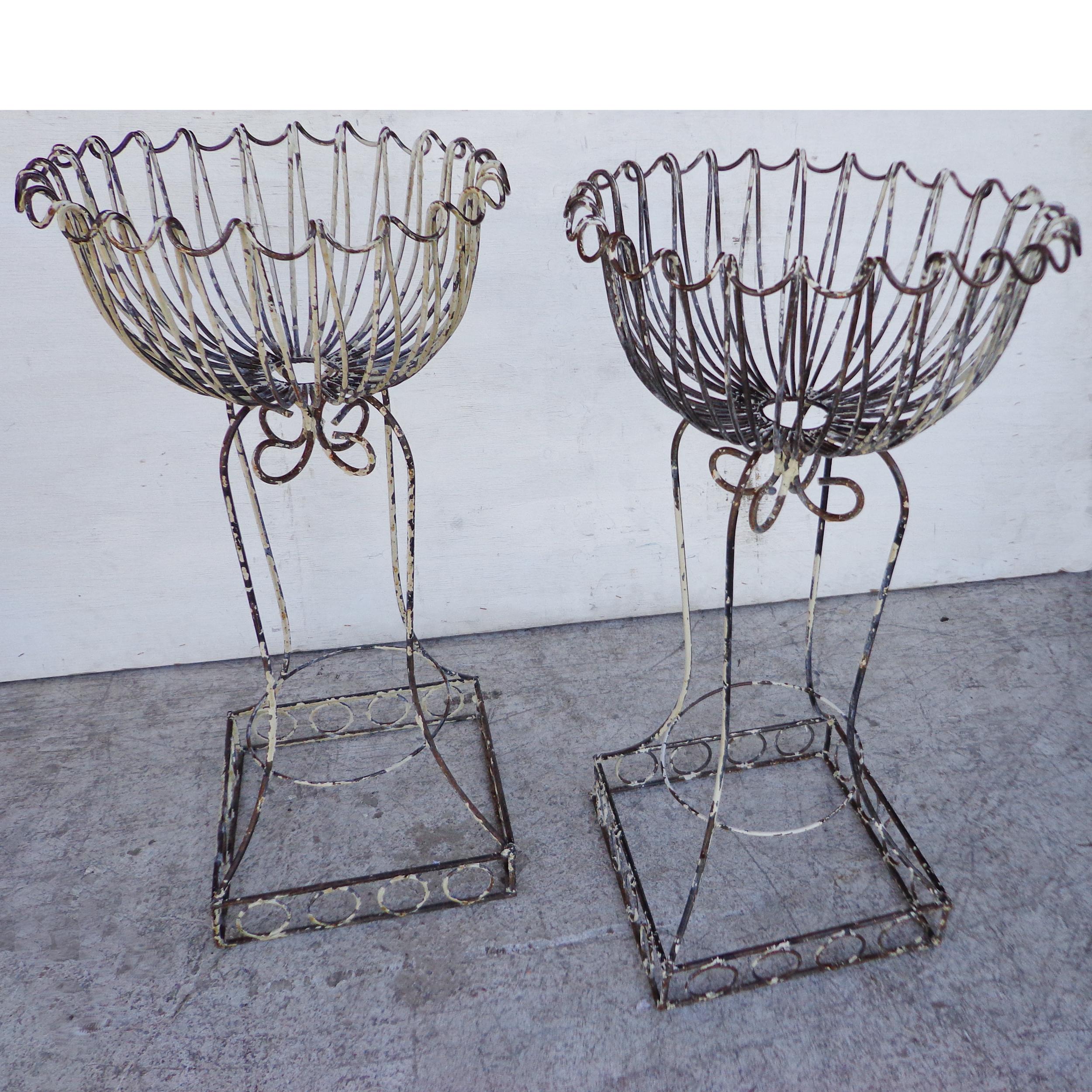 Pair of European antique wire planters

Charming pair of wrought iron planters from France. Original wear and patina. 



 