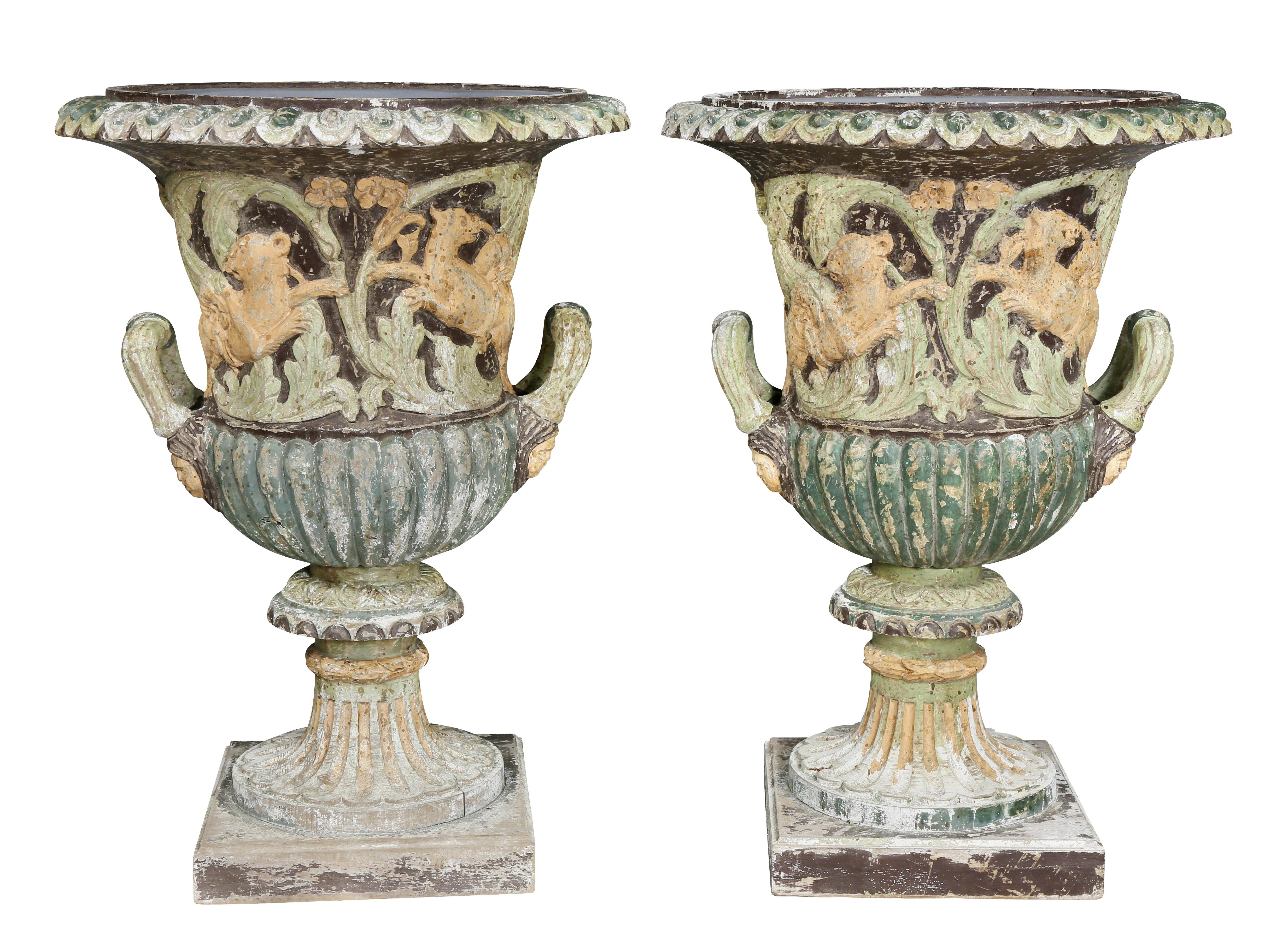 Each with lions and foliage with two handles and square base. Provenance; Estate Of Michael D. Dingman.