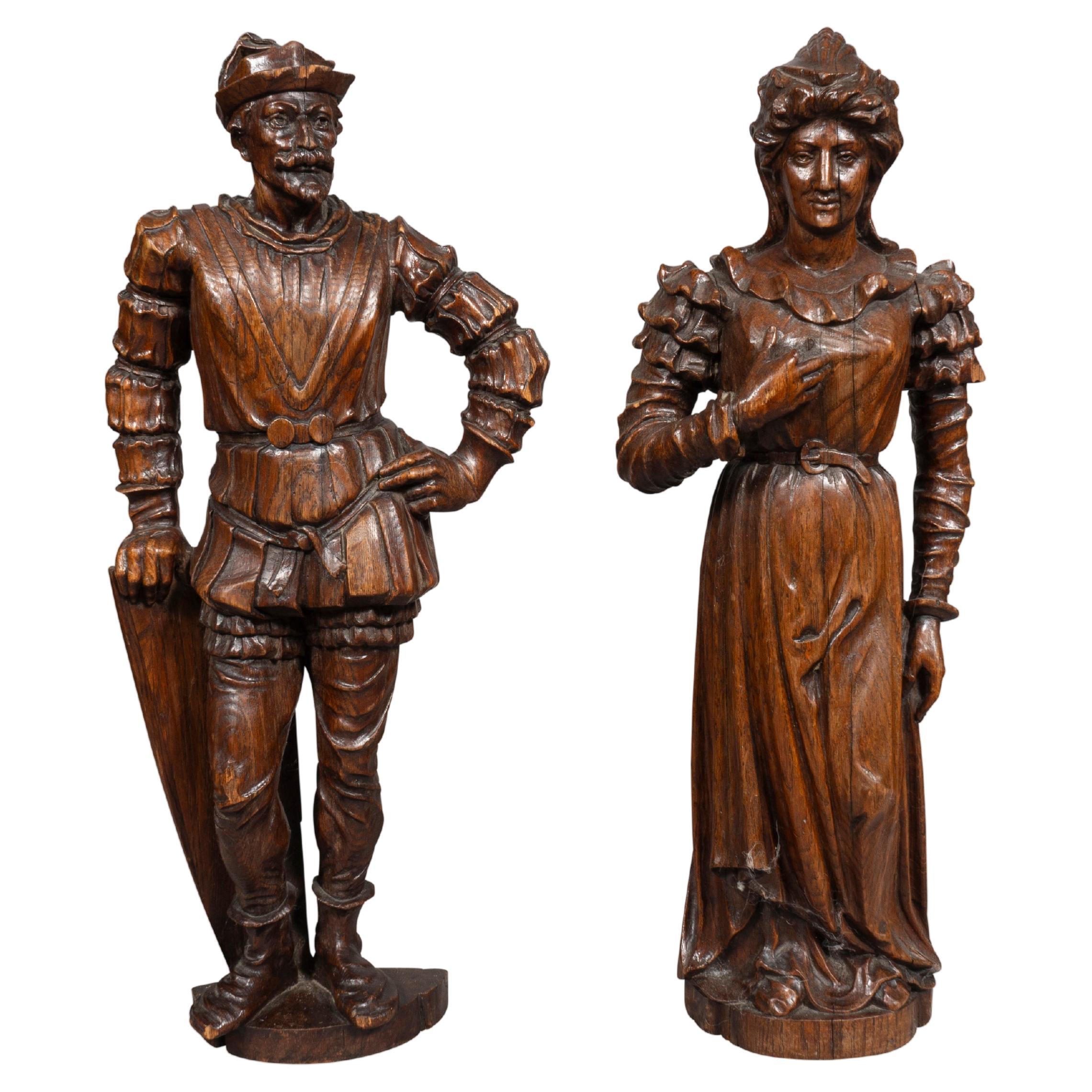 Pair Of European Carved Figures Of A Man And Woman For Sale