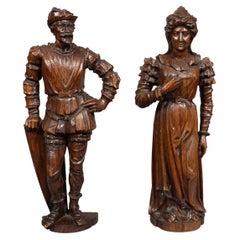 Paire de figures européennes sculptées d'un homme et d'une femme