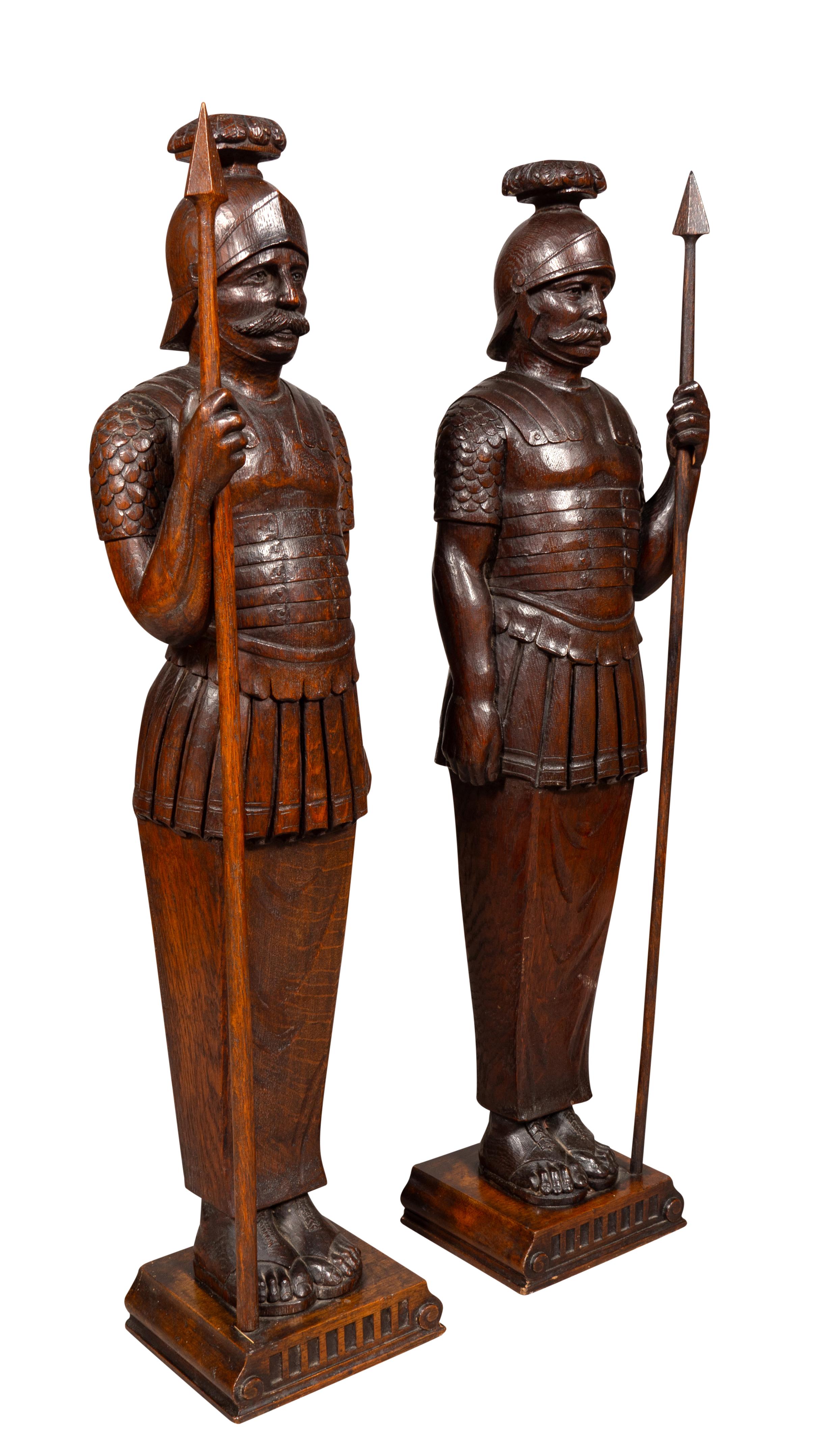 Well carved standing figures holding spears. Amherst Mass collectors estate.