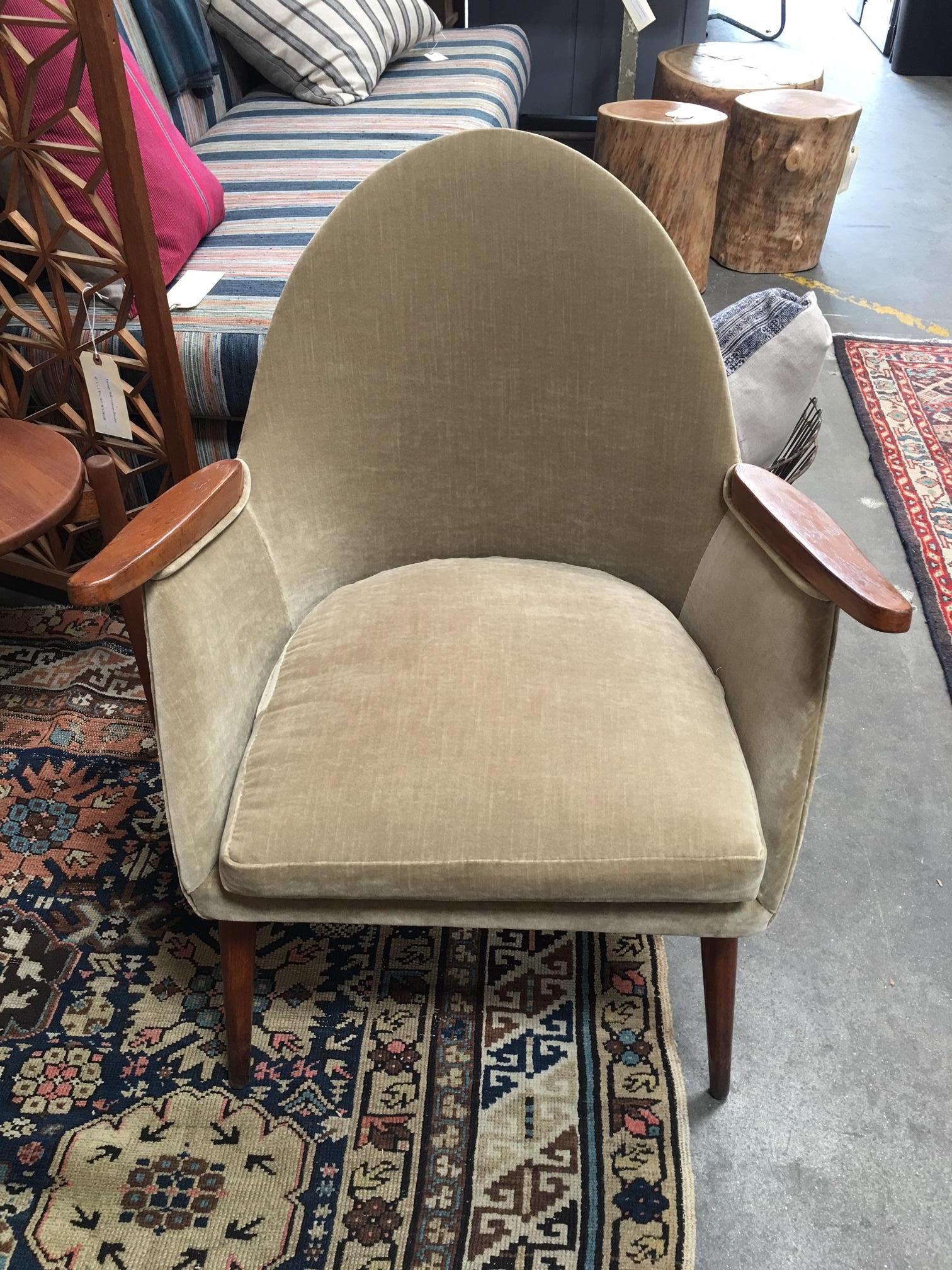 A pair of beautiful midcentury chairs from Europe in a light sage green velvet fabric.