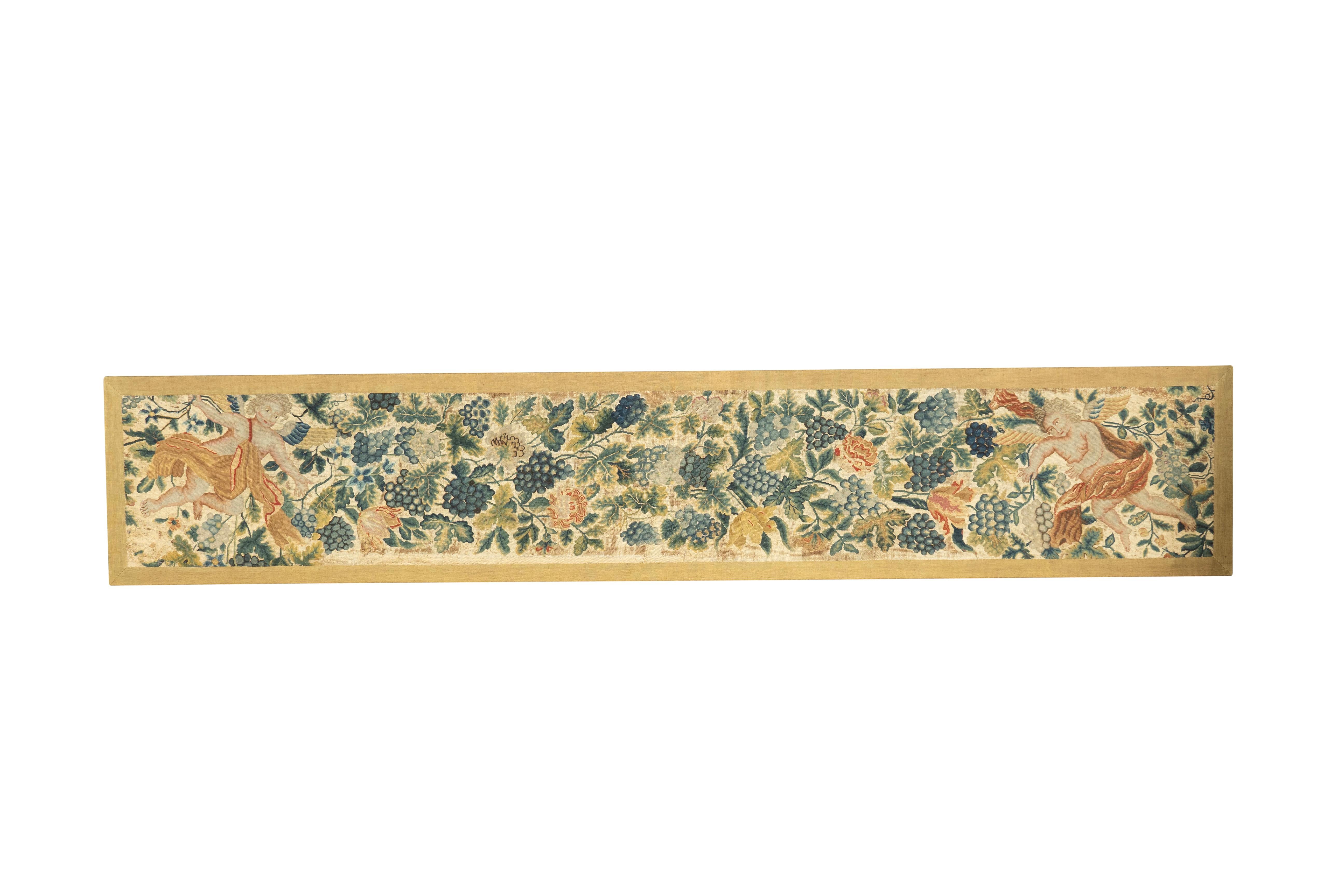 Two rectangular panels each featuring a pair of cherubs amongst grape leaves and grapes. Would be great in a dining room.