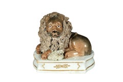 Pair Of European Porcelain Figures Of Reclining Lions