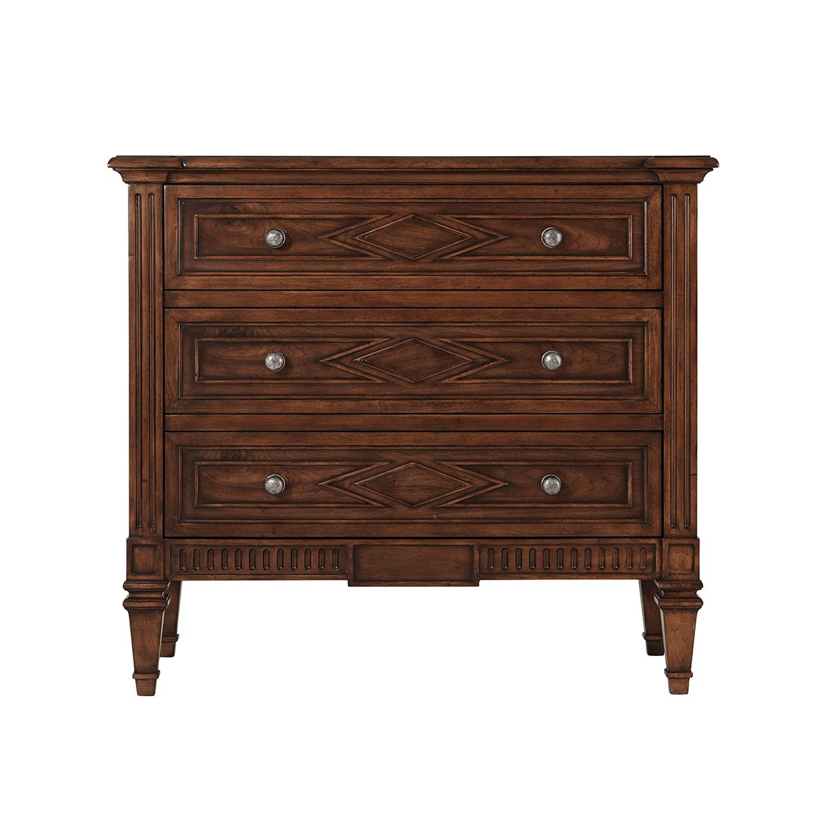 beech and walnut with a molded edge rectangular top, three long paneled drawers with lozenge detailing and antique pewter handles, with carved fluted details and raised on square tapered legs.
Dimensions: 36