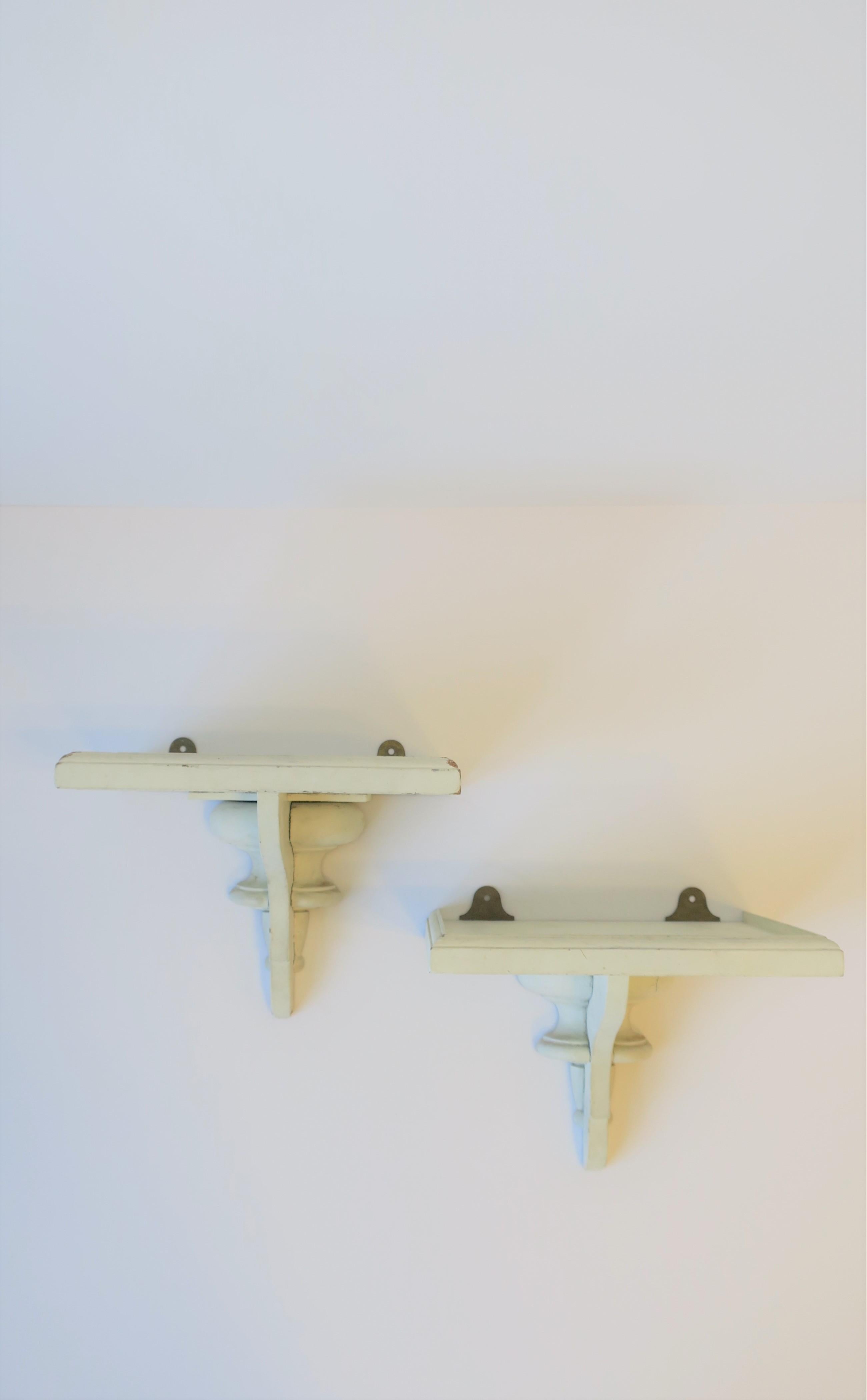 white wooden shelf with brackets