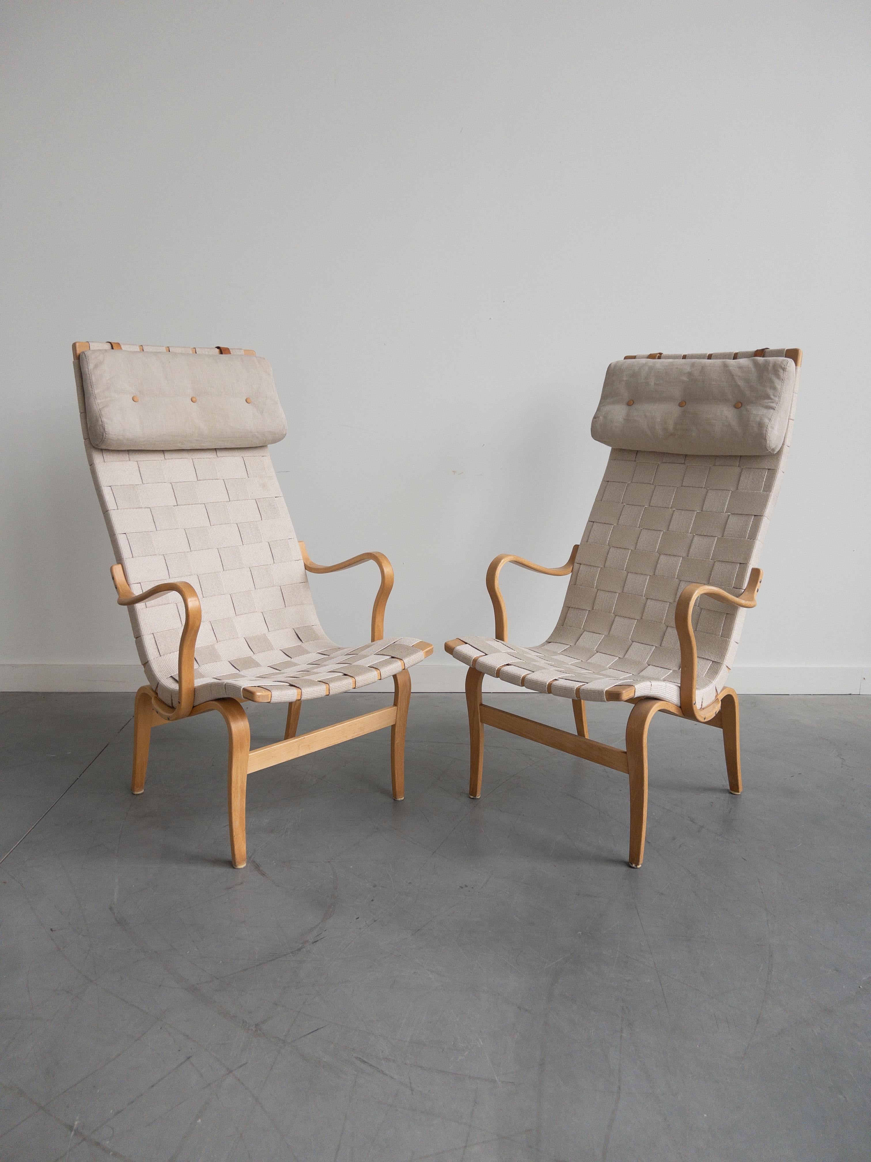 Set of Eva Easy Lounge Chairs by Bruno Mathsson, Made in Sweden. Beech Wood arm chair with beige webbing. Eva chairs, designed by Bruno Mathsson for DUX. Stamped by maker. 