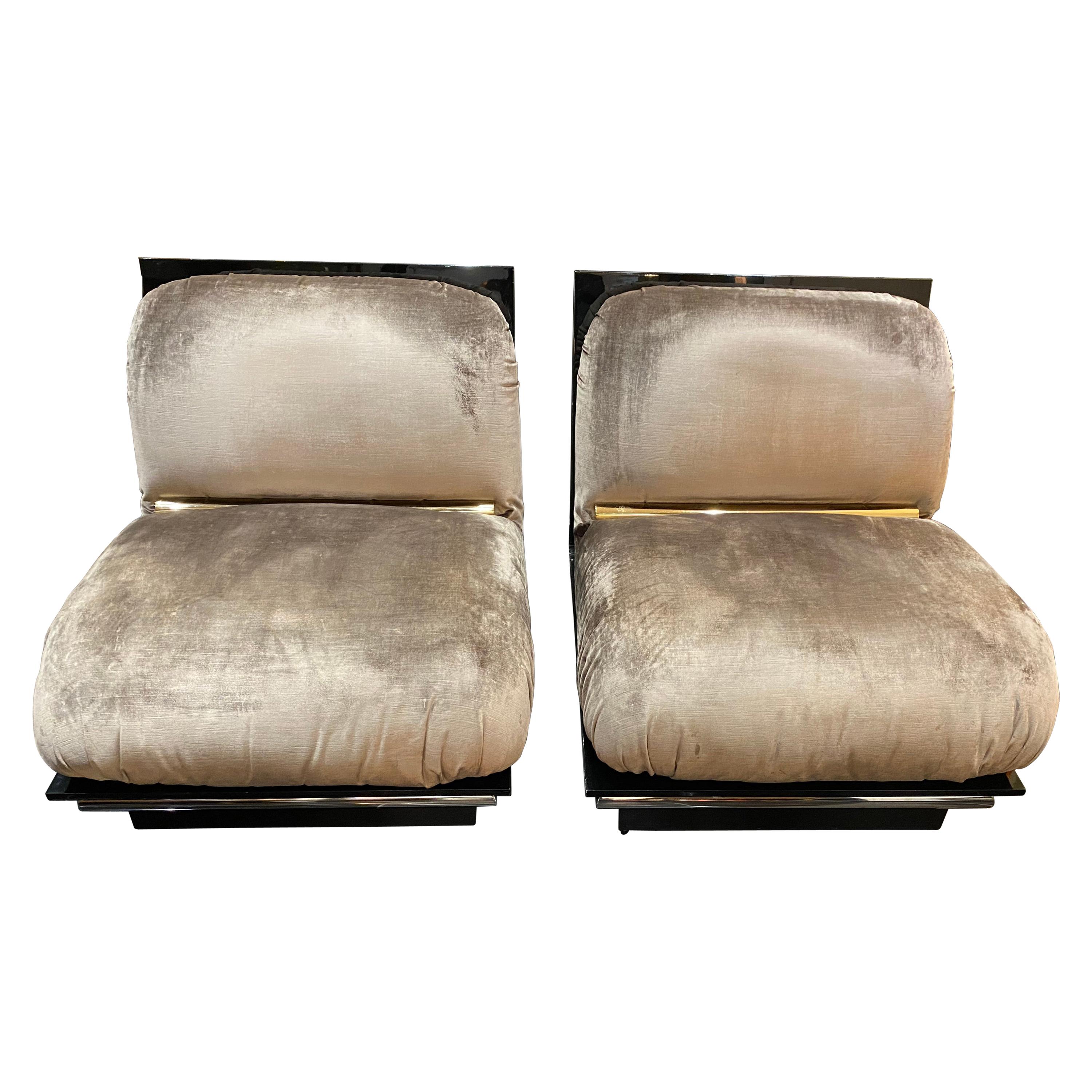 A totally unique large pair of lounge chairs with two centimetre thick solid lucite frame and fabulous bi-metal detailing covered in its original silk velvet.