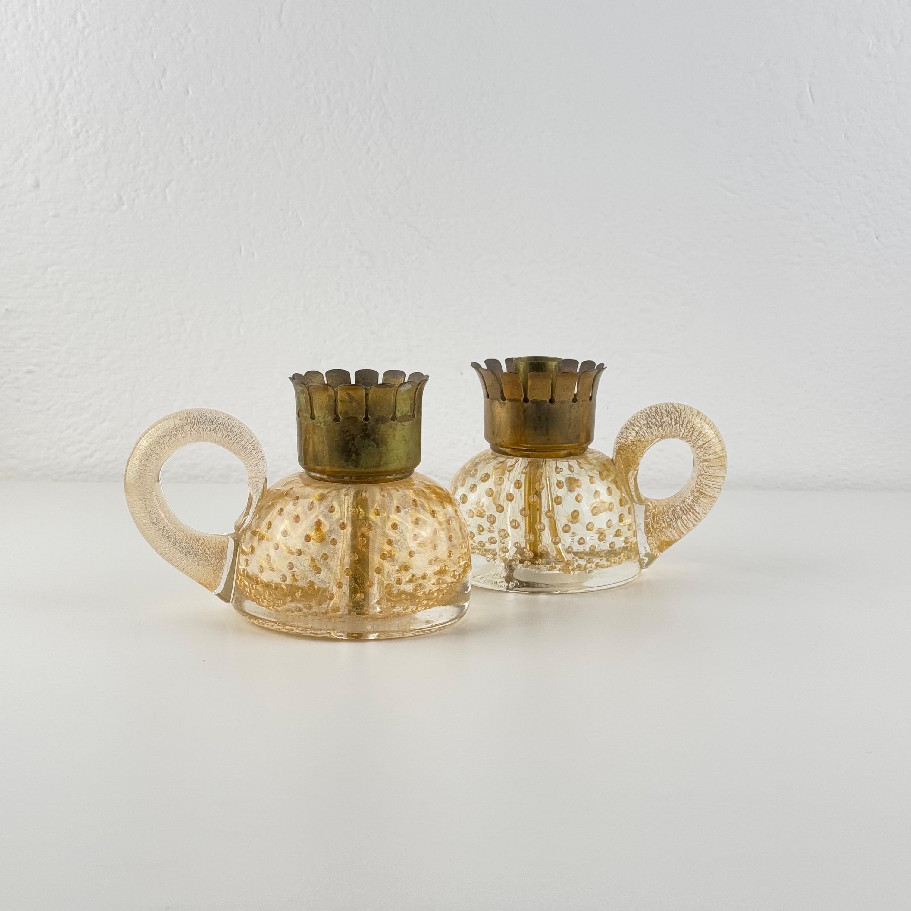 An extraordinarily rare pair of Murano glass candleholders designed by Ercole Barovier and executed by Barovier & Toso in 1938. These sculptural pieces display all the hallmarks of Barovier’s most sought-after pre-war production: dense pulegoso