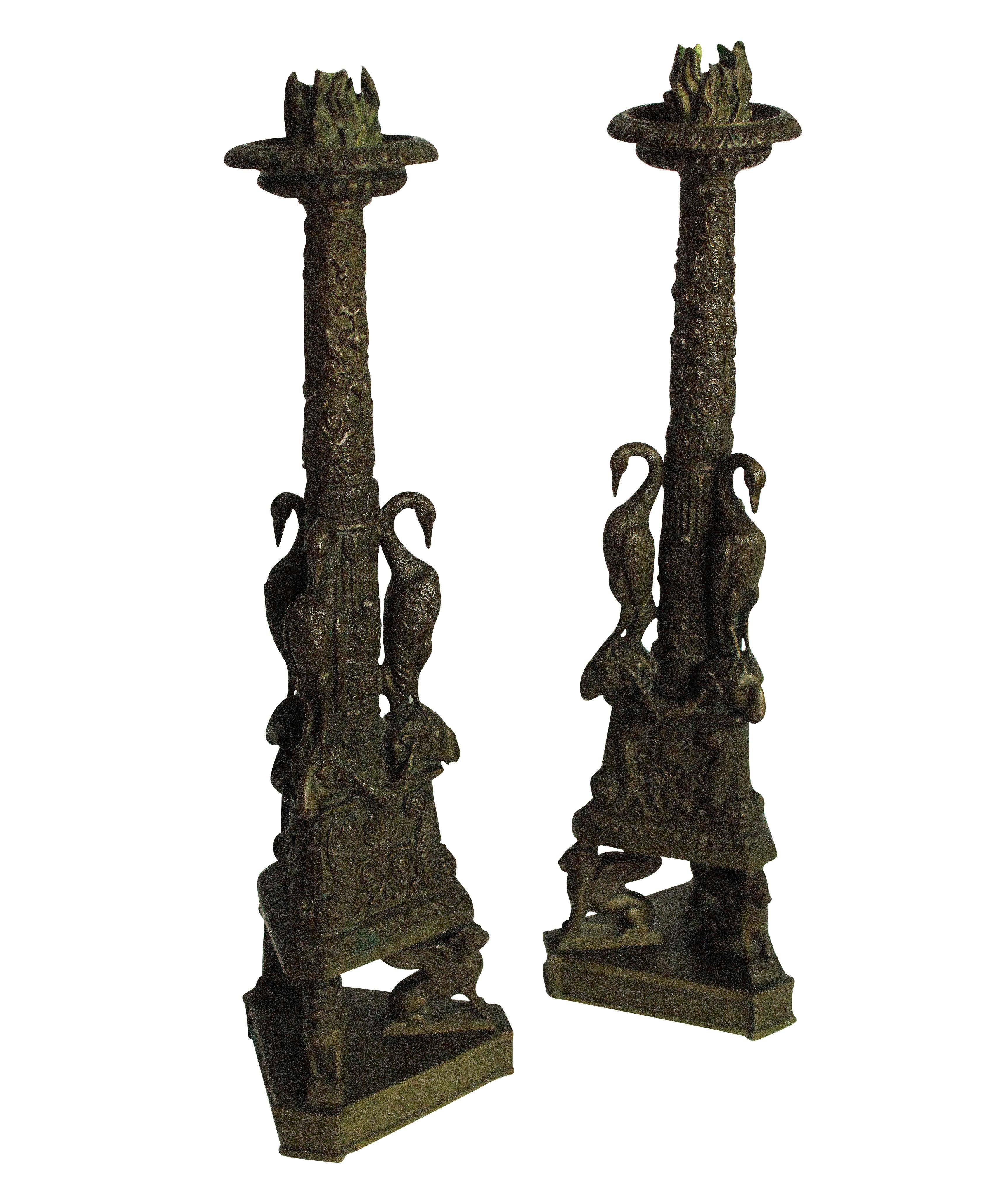 A pair of English bronze candlesticks of fine quality, after the design by Giovanni Battista Piranesi.