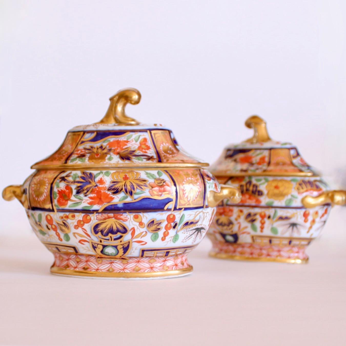 Of the highest quality, possibly Chamberlains Worcester, these early sauce tureens feature great details, extreme refinement and an unusually light palette with sections of salmon colored ground with gilt decoration as well as fresh green tree and