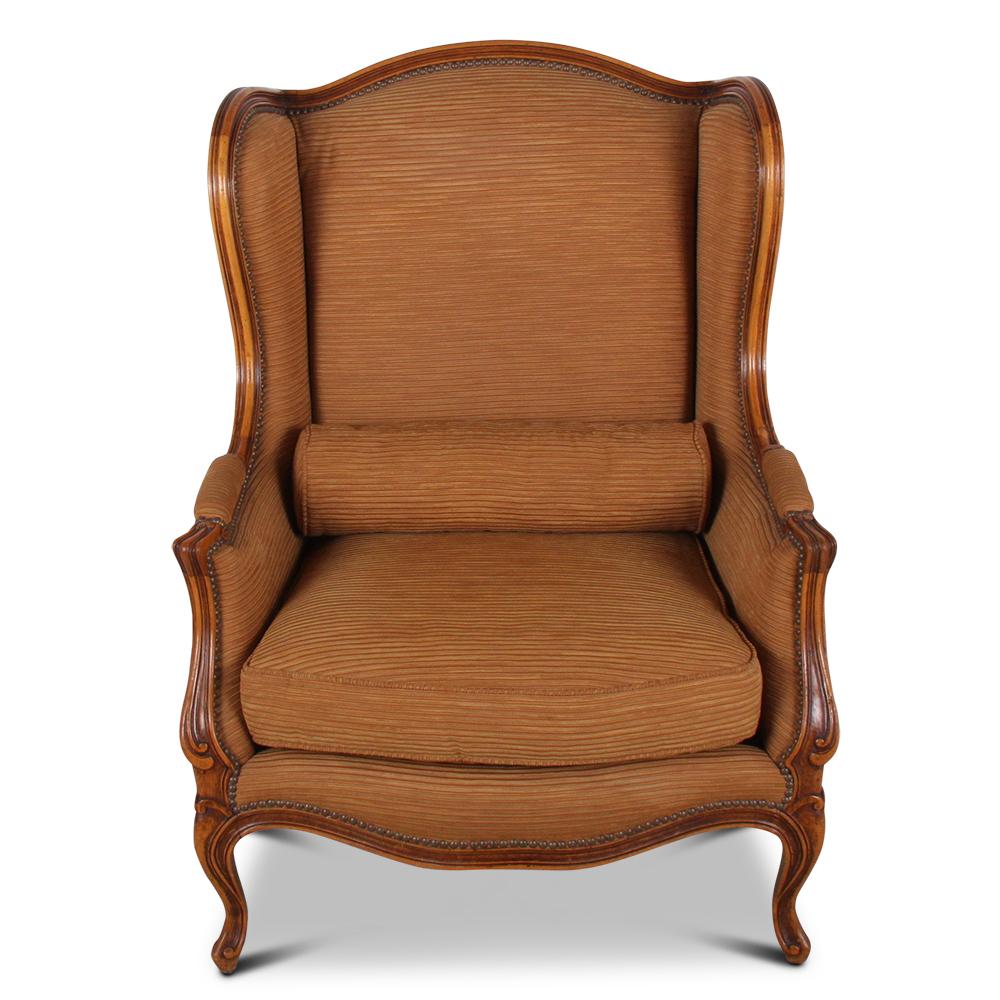 A highly sought after pair of French carved wingback chairs in excellent condition.