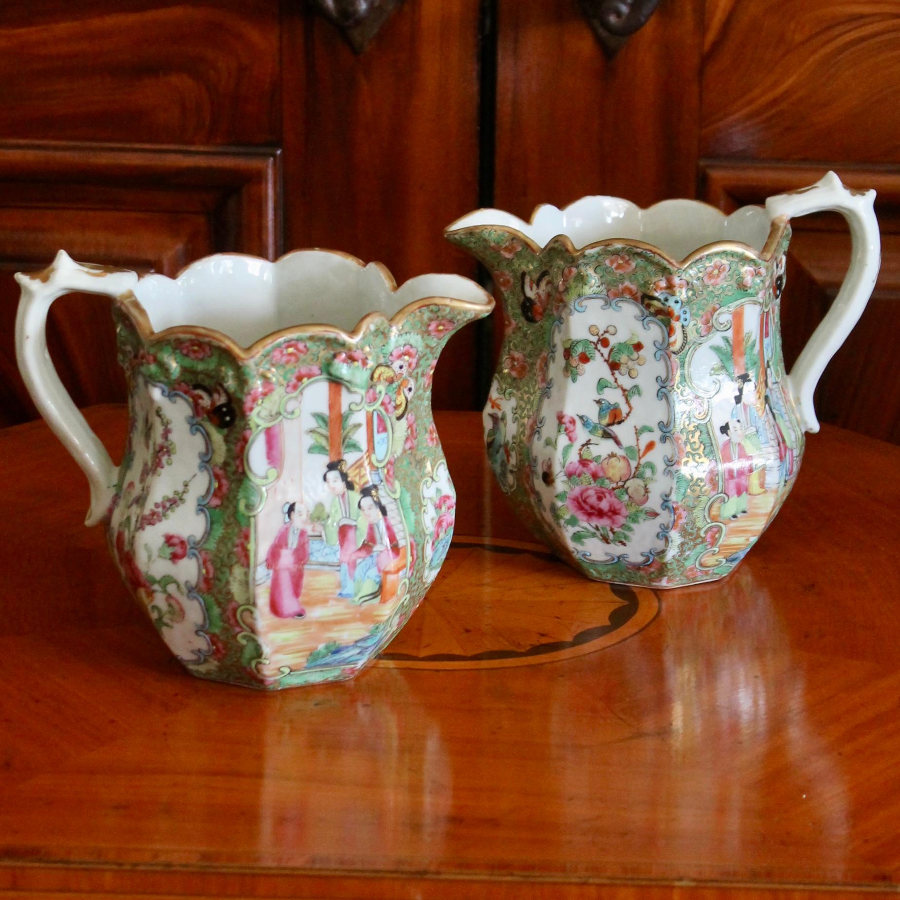 An unusual pair of sizable Rose Medallion jugs, much larger than cream pitchers, with fine details and of unusually high quality. These would be stunning used for flower arrangements or for display. Colors are very strong and clear, gilding is