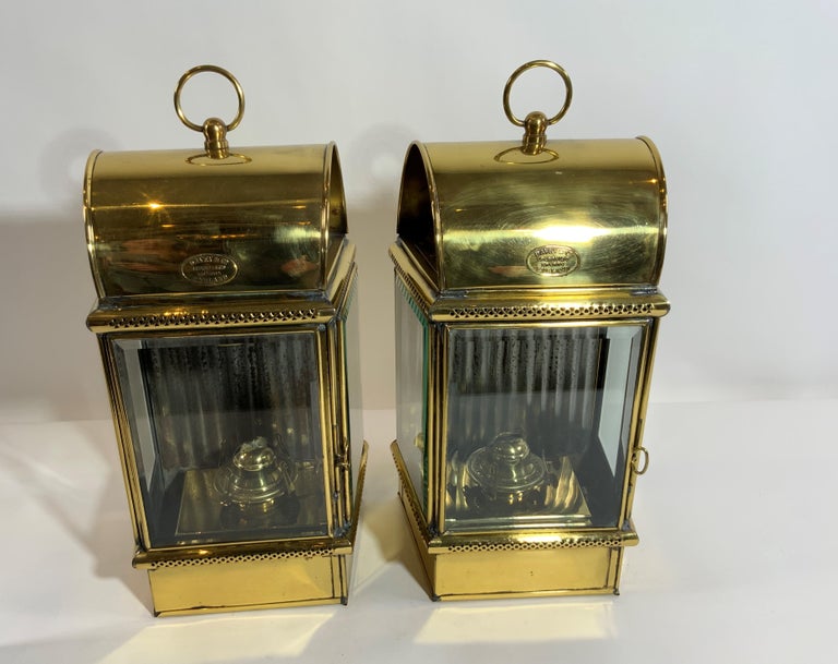 Pair of top quality Davey & Co. ships lanterns. With arched and vented tops, carry handles, beveled glass, hinged doors, burners, etc. Fitted with makers badges reading 