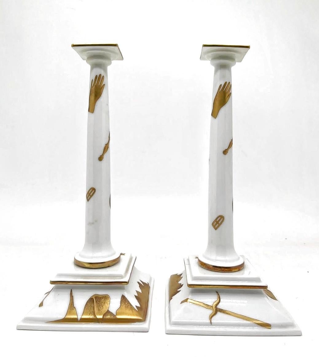 In this listing you will find a pair of striking, very rare candlestick holders designed by Gio Ponti in 1927 for Richard Ginori. Candlesticks are done in white ceramics with details done in 24k gold. The candlesticks have been originally designed