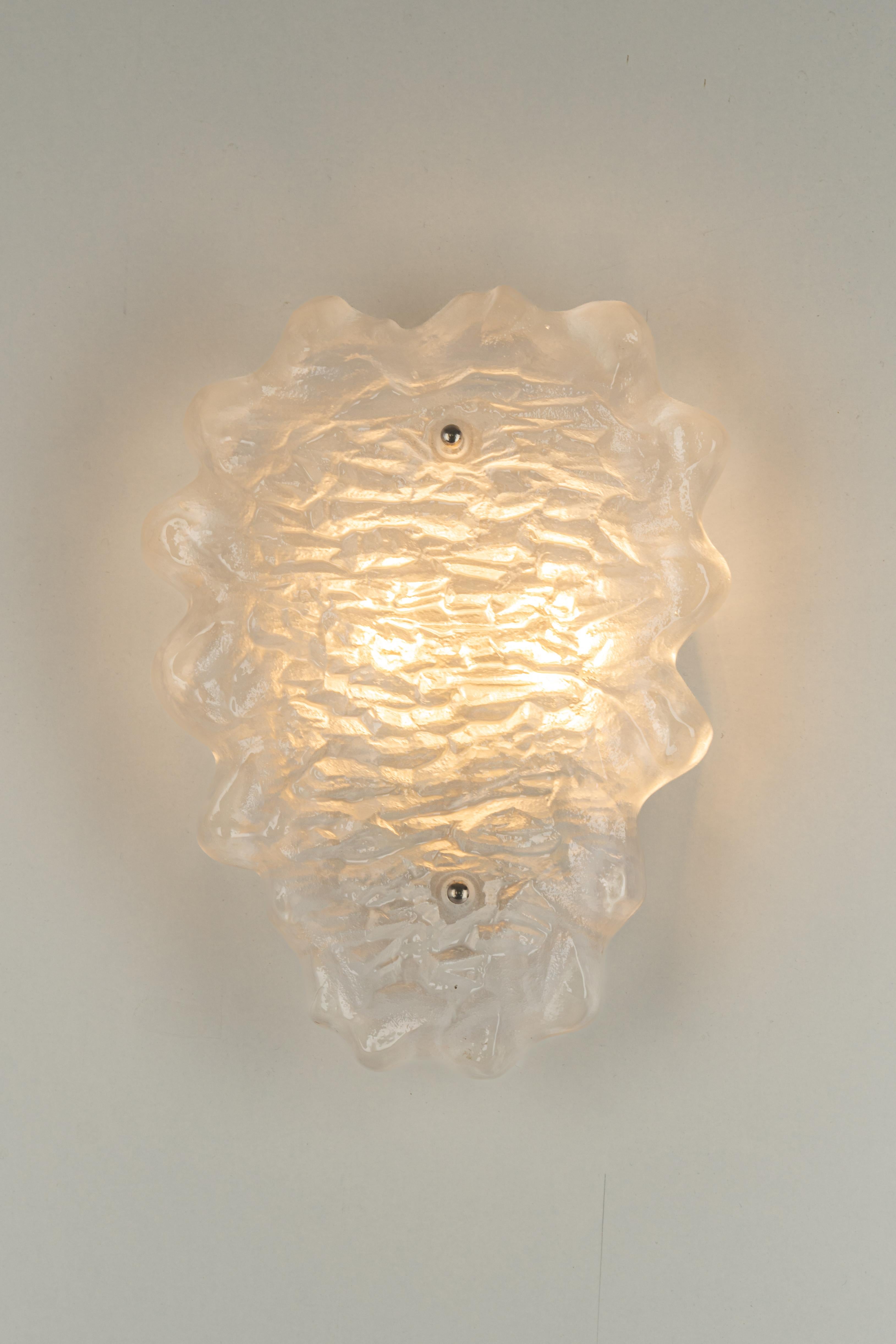Exclusive Sputnik crystal glass wall sconce by Peil & Putzler, Germany, 1970s 
Wonderful light effect.
Extremely rare!

High quality and in very good condition. Cleaned, well-wired and ready to use. 

Each fixture requires 2 x E14 small