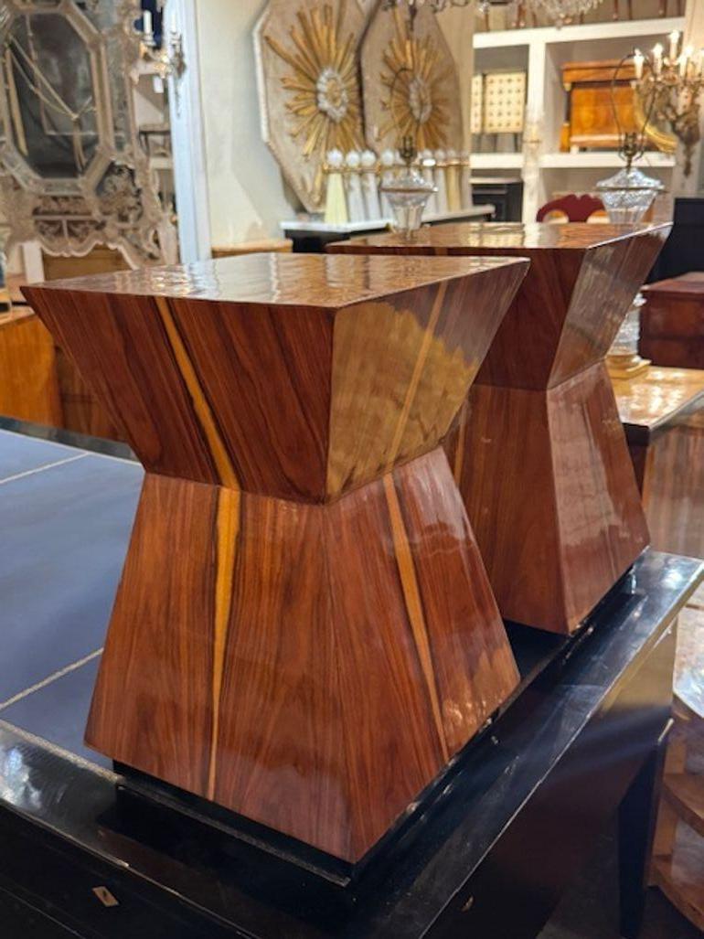 This product is a pair of modern exotic wood side tables, perfect for those looking to add a unique touch to their home decor. . functional addition to any living space. The unique shape and gorgeous wood adds a touch of luxury and sophistication,