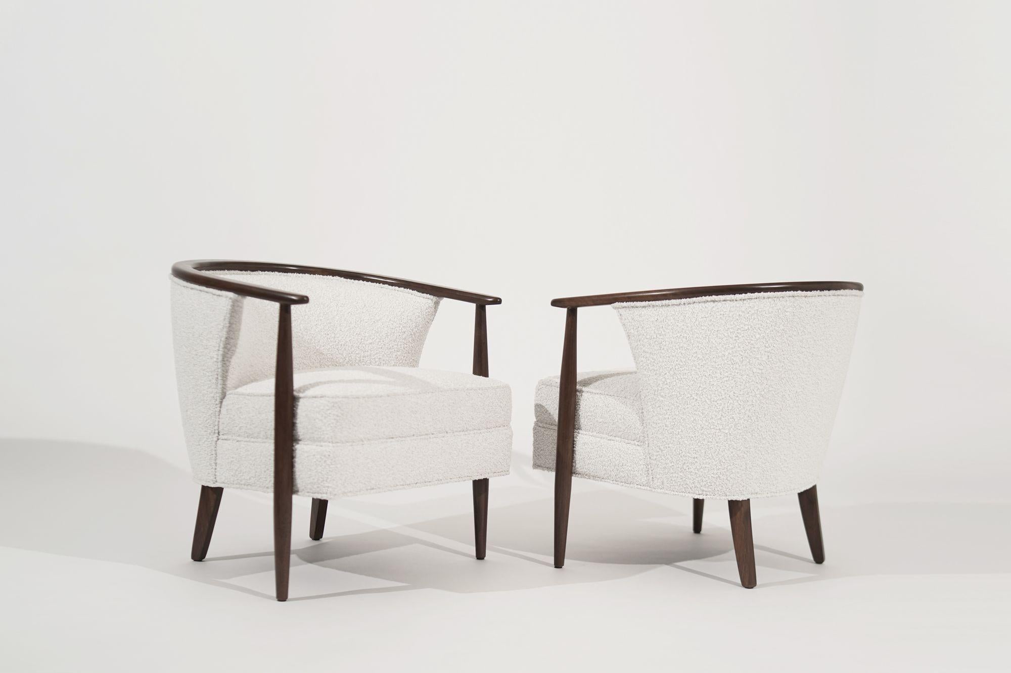 A pair of stunning sculptural chairs by Kodawood, circa 1960s, now fully restored. These chairs are a true celebration of mid-century modern design, featuring elegant curves and bold lines that create a sense of movement and fluidity.
Crafted from
