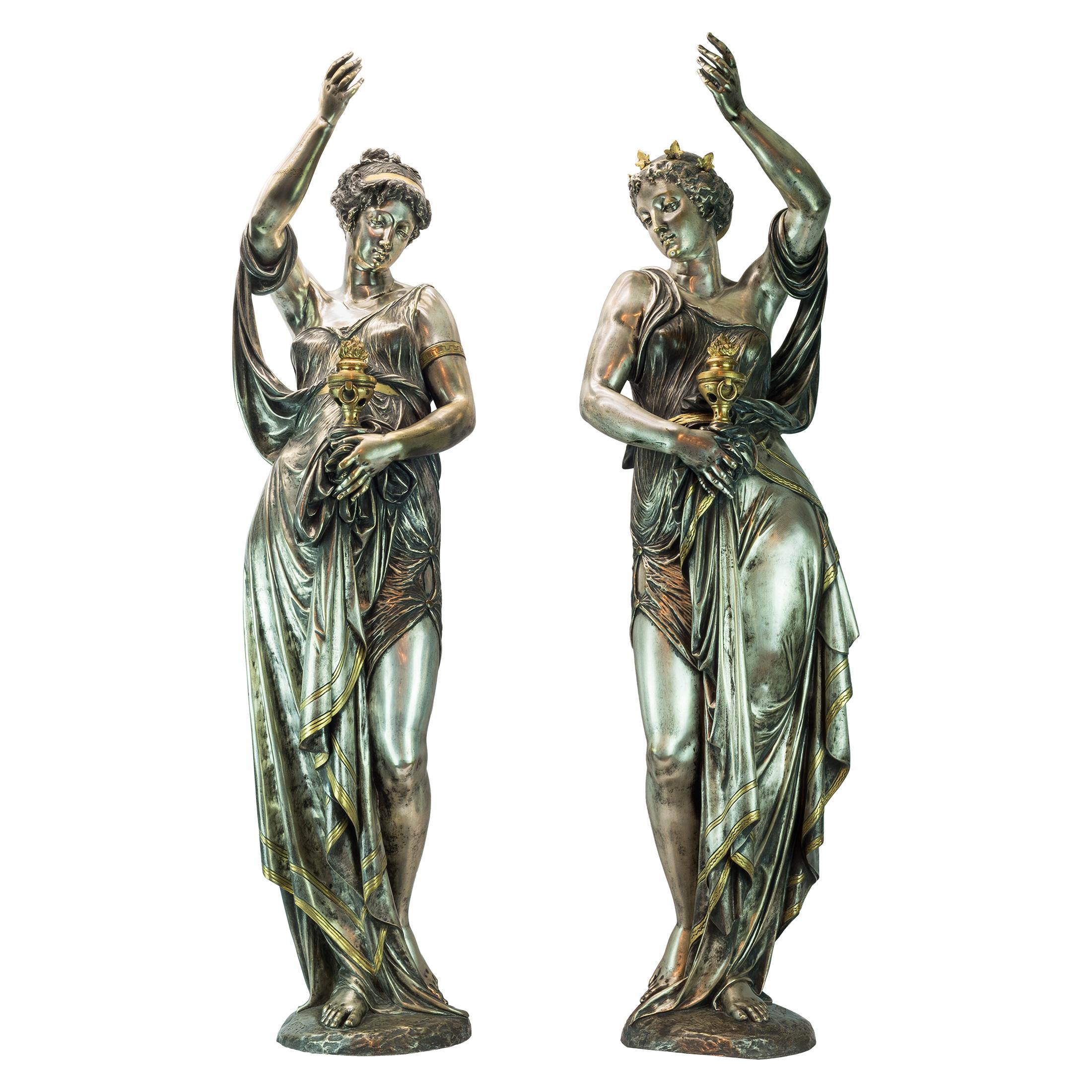 Pair of Highly Important Exposition Neo-Grec Silvered and Gilt Bronze Figural Bacchante Torchères.
 
Artist: Albert-Ernest Carrier-Belleuse (1824-1887)
Origin: French
Date:third quarter 19th century
Inscription: one figure inscribed CARRIER,