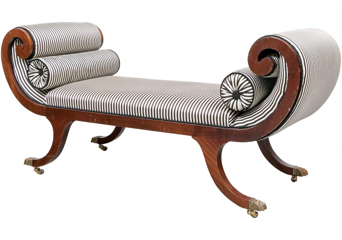 A very fine pair of Diminutive Neoclassical Style Recamiers. The square curved legs ending in brass paw capped feet on casters. Custom upholstered in a brown and ecru silky stripe. Each having a pair of separate matching bolsters. 
Measures: Length