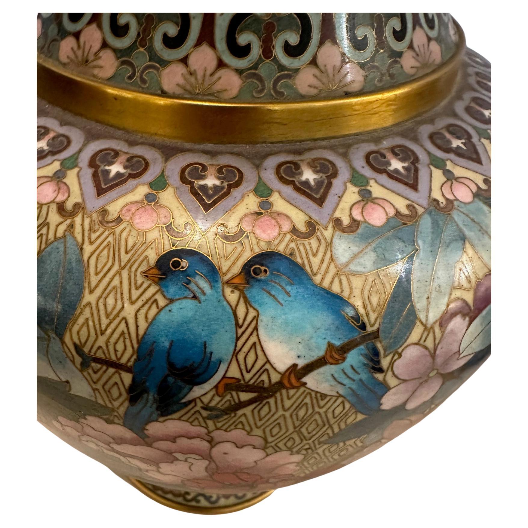 Pair of lovely Chinese gilded enamel on bronze Cloisonne vases
adorned with Cherry Blossoms,  Peonies and Blue birds.
