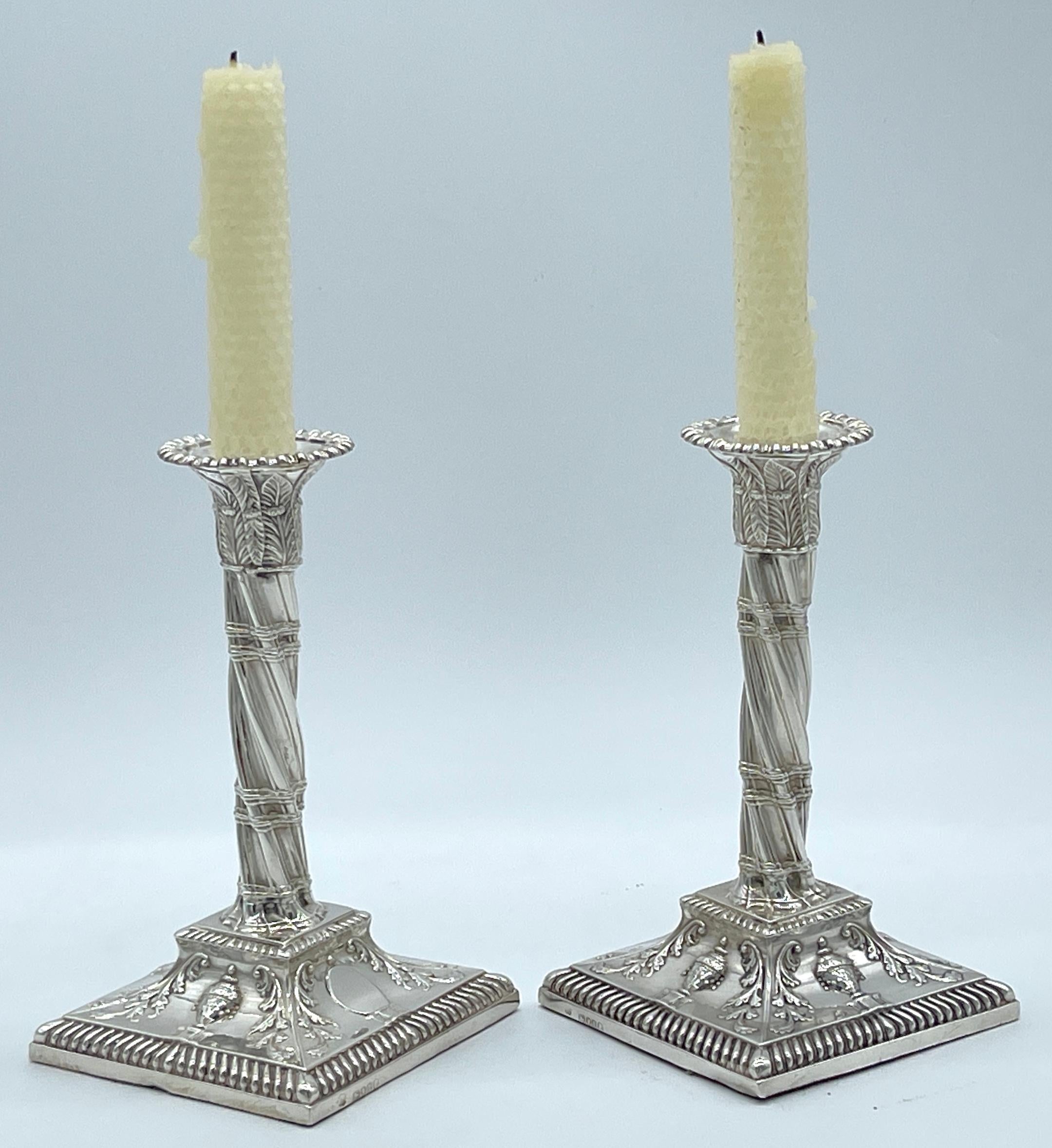 Pair of Exquisite English Victorian Sterling Neoclassical Column Candlesticks 
London,  1884-1885, Hallmarks for John Aldwinckle & Thomas Slater

A fine pair of English Victorian sterling silver neoclassical column candlesticks, crafted by John