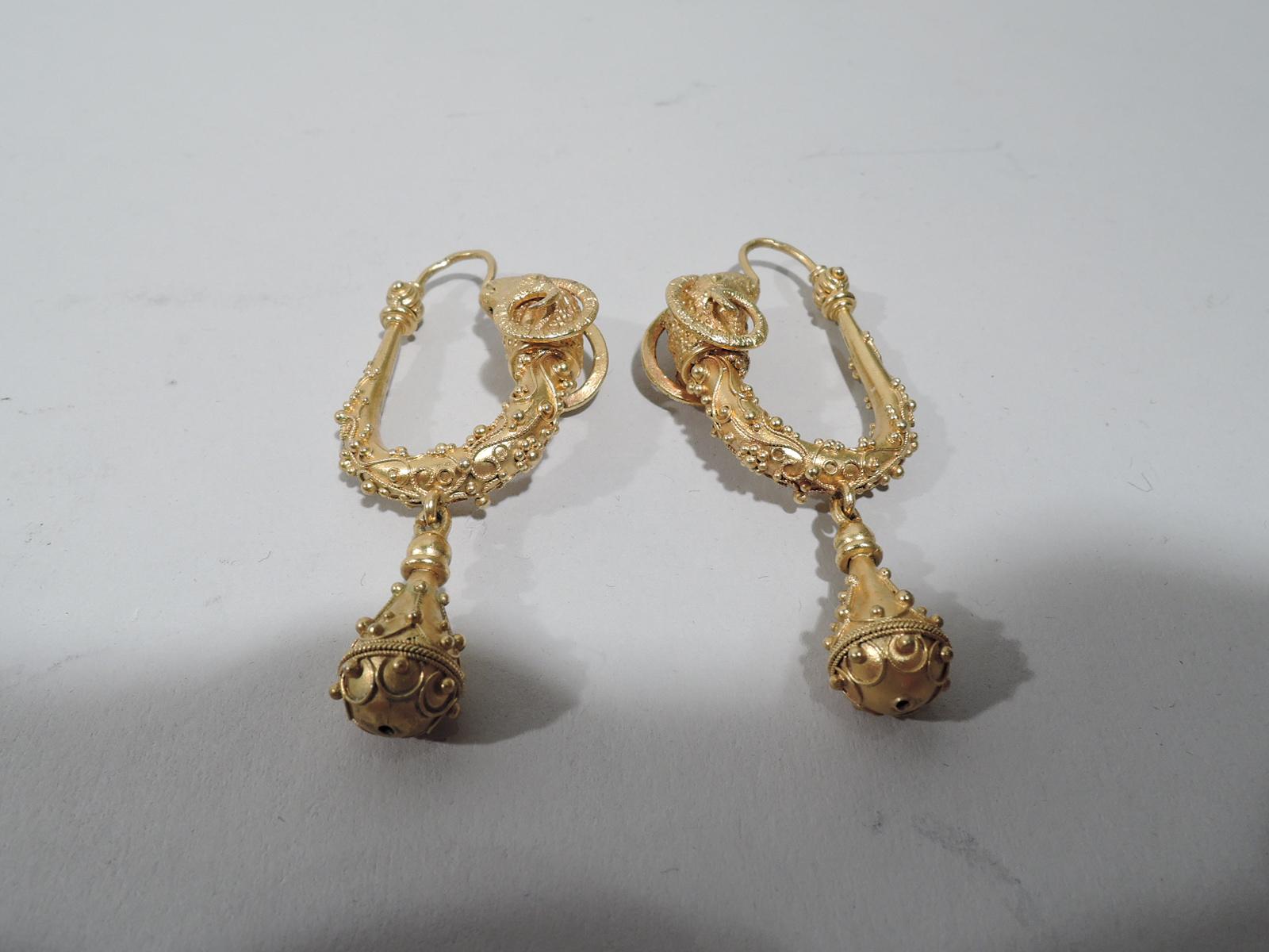 Pair of exquisite Italian Etruscan Revival 18k gold earrings, ca 1860. U-form with ram head terminal, and applied beading and rope; drop same. Back to front. Beautiful craftsmanship. Marked. 