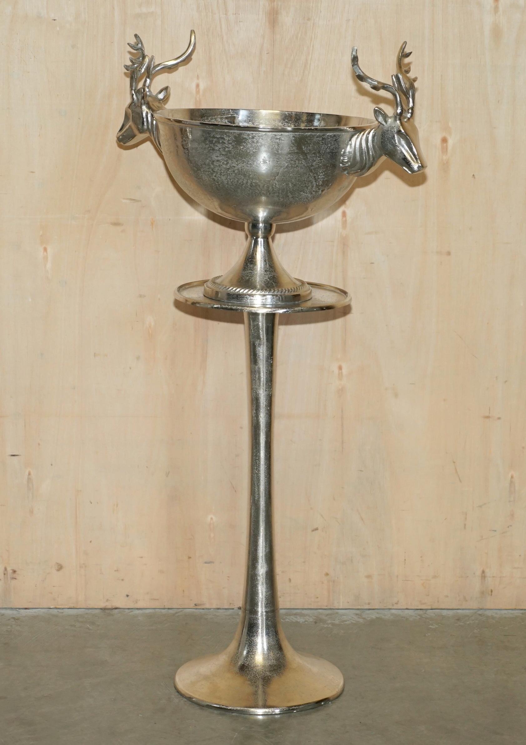 Royal House Antiques

Royal House Antiques is delighted to offer for sale this absolutely exquisite pair of extra large white metal Stag or Reindeer Champagne buckets on the original side tables 

Please note the delivery fee listed is just a guide,