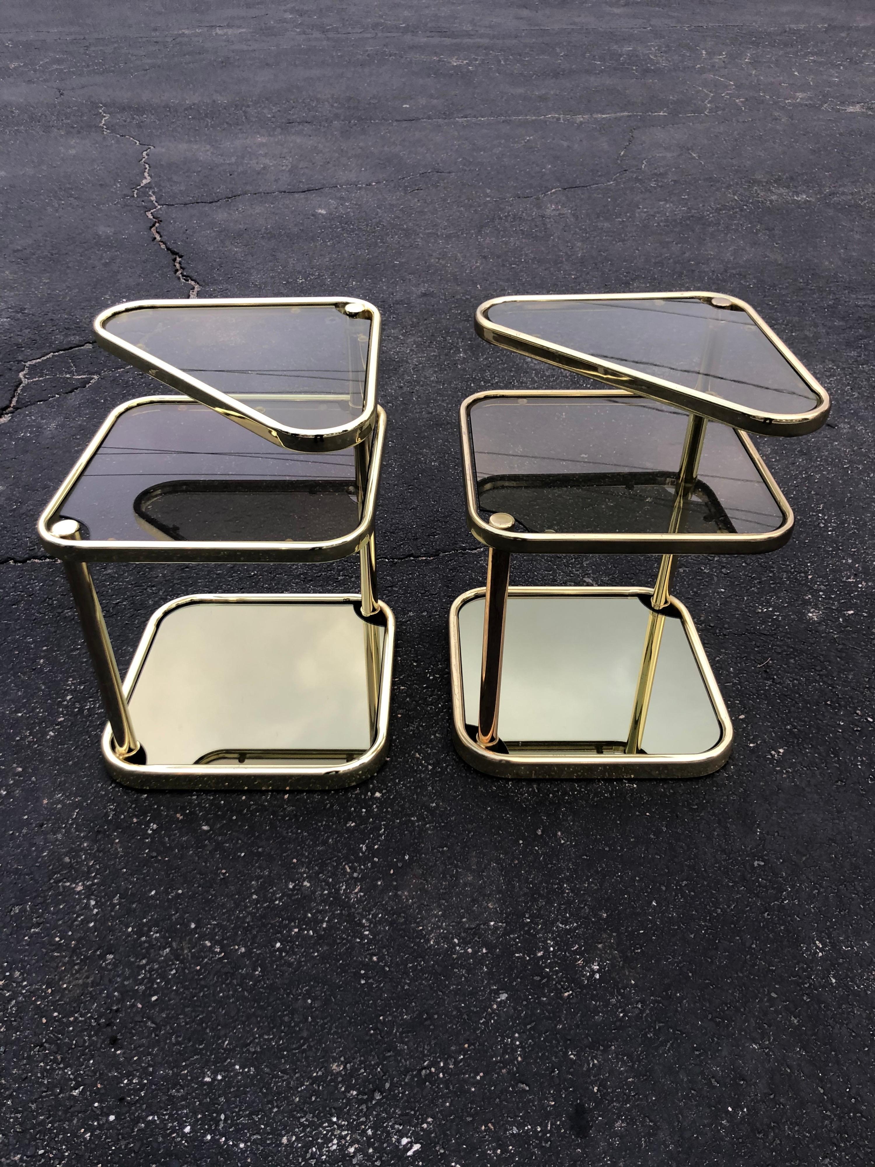 Mid-Century Modern Pair of Extendable Three Tier Brass and Smoked Glass Tables For Sale
