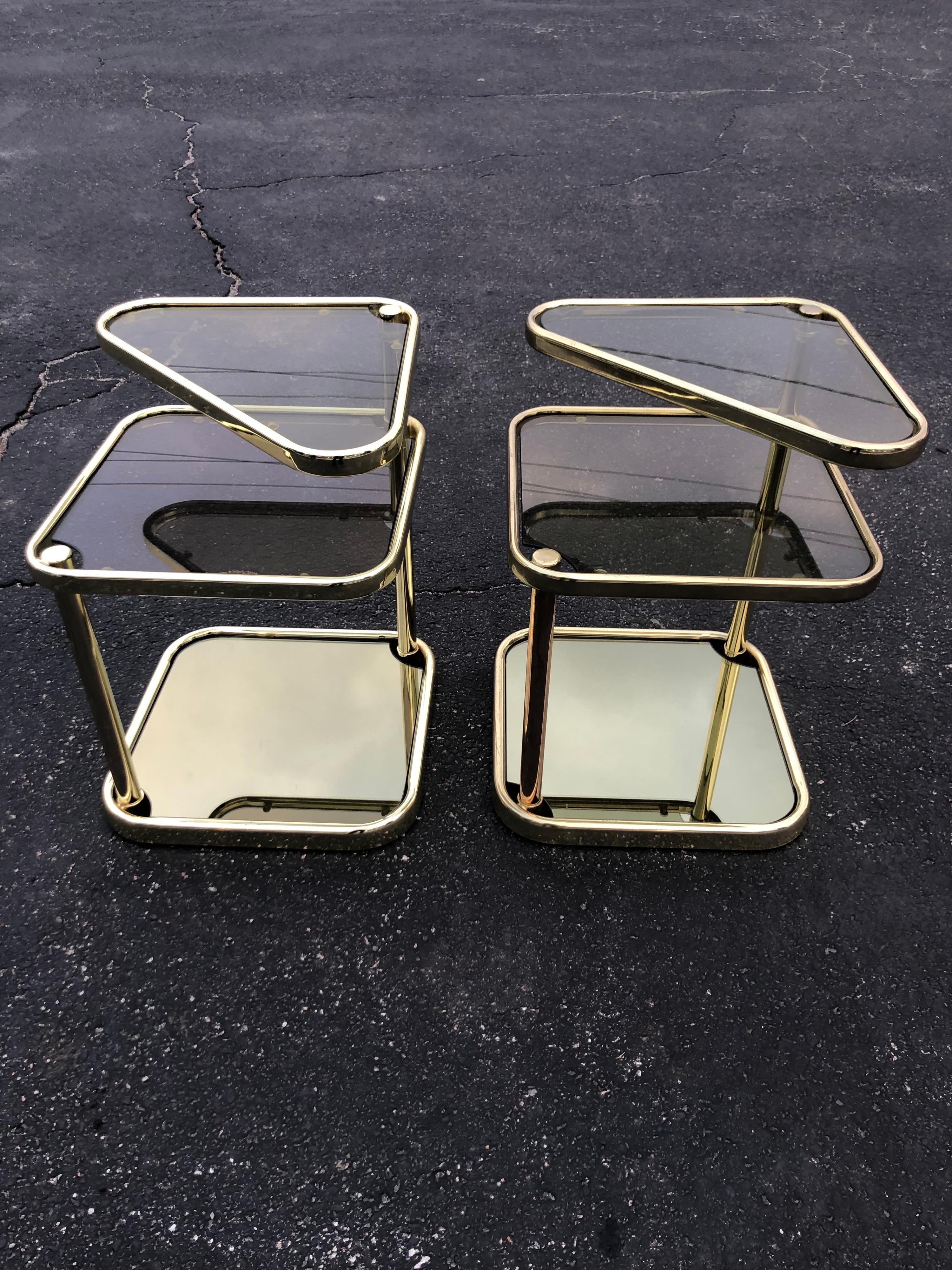 Pair of Extendable Three Tier Brass and Smoked Glass Tables In Good Condition For Sale In Redding, CT