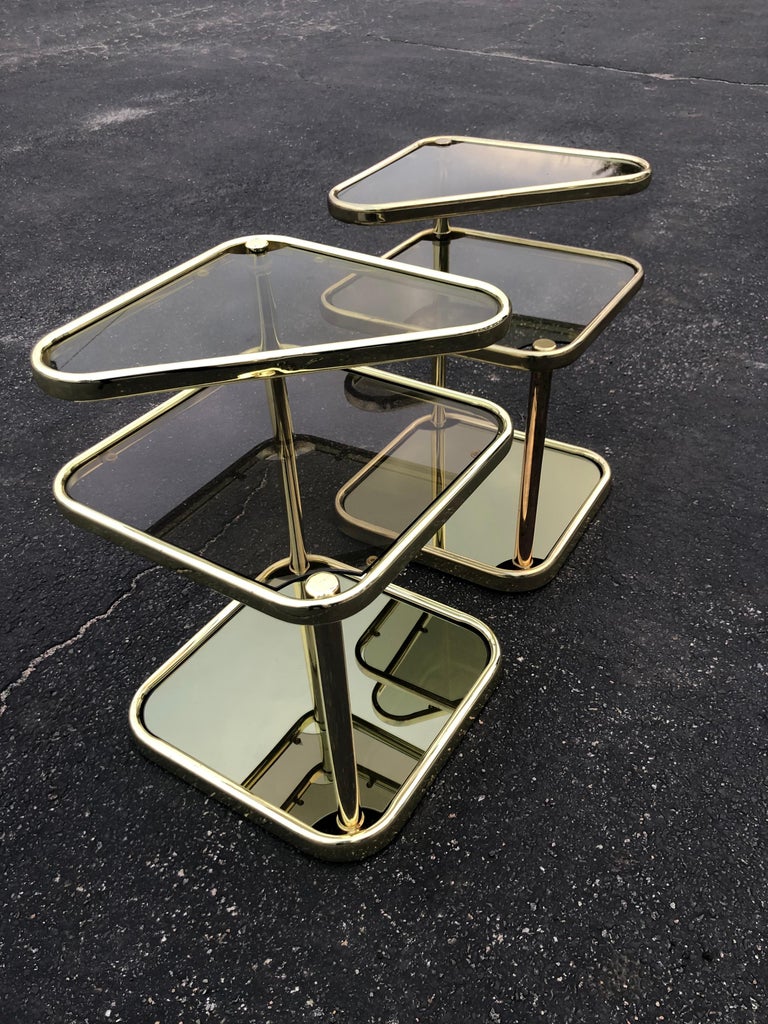 Pair of Extendable Three Tier Brass and Smoked Glass Tables For Sale at