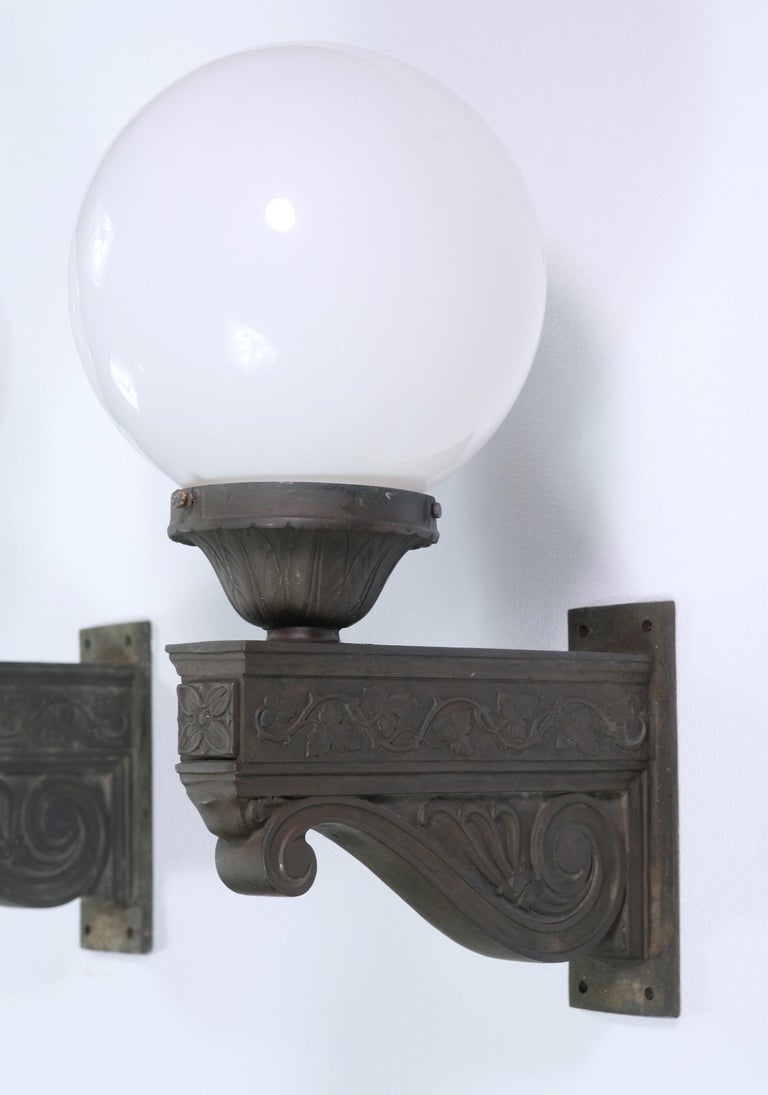 Pair of Exterior Bronze Wall Sconces w/ Foliate Details and Round Glass