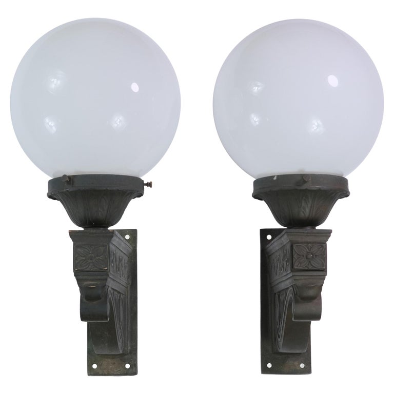 Pair of Exterior Bronze Wall Sconces w/ Foliate Details and Round Glass