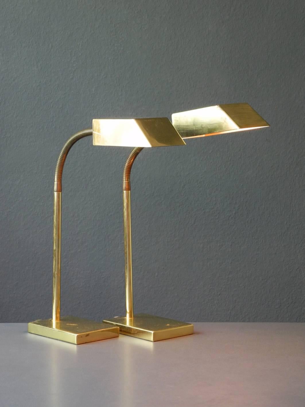 Pair of very large Mid-Century Modern table lamps from the Vereinigte Werkstätten. Made in Germany. Great minimalistic design in original vintage condition. Completely made of solid brass. Flexible neck, steplessly adjustable in all directions.