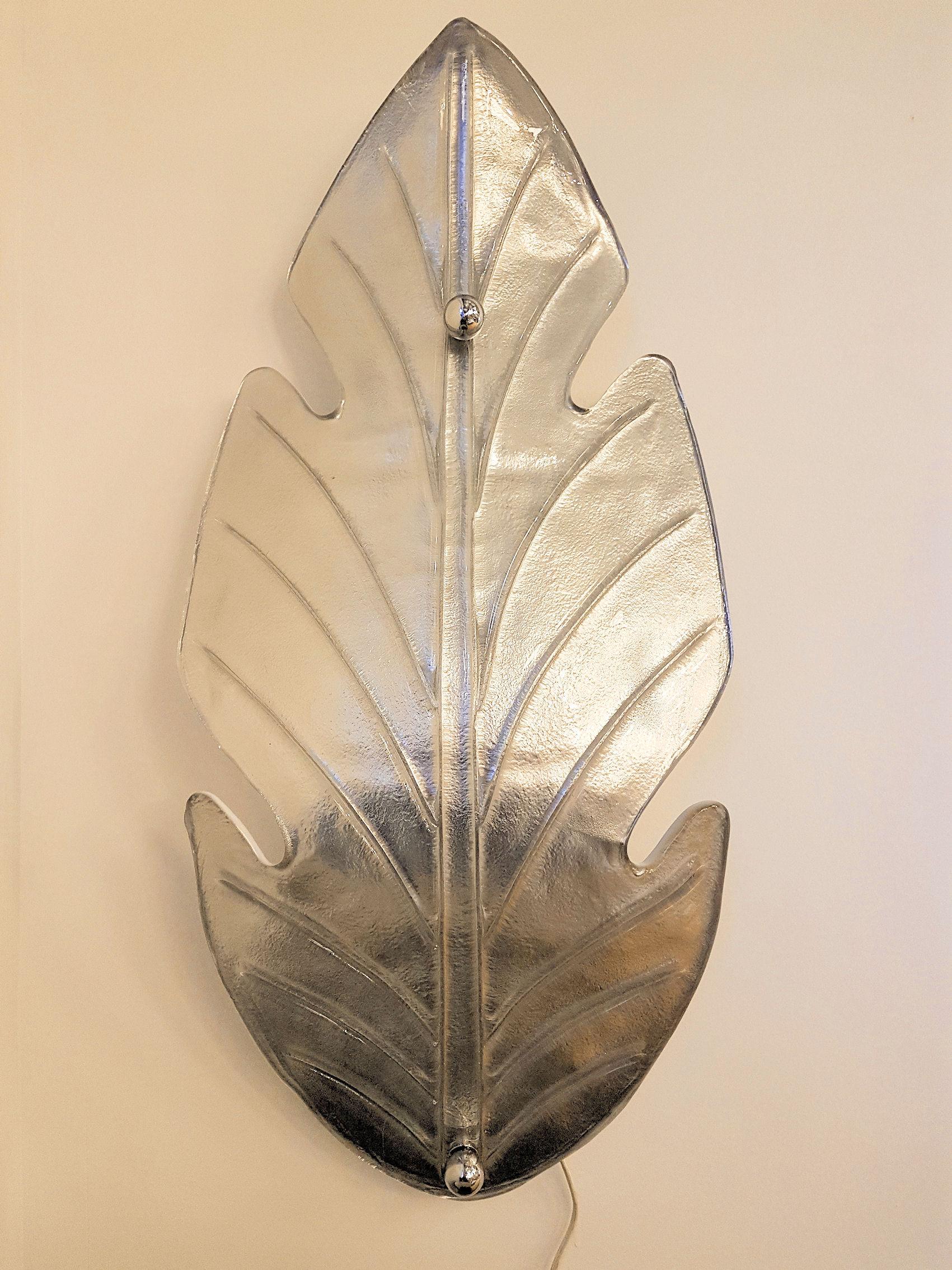 Extra large pair of Mid-Century Modern leaf shaped, silver Murano glass sconces.
Attributed to E. Barovier, Italy, circa 1970s.
Made of one unique piece of Murano glass, silver w/a mirror effect color outside, and white inside.
Opaque when light is