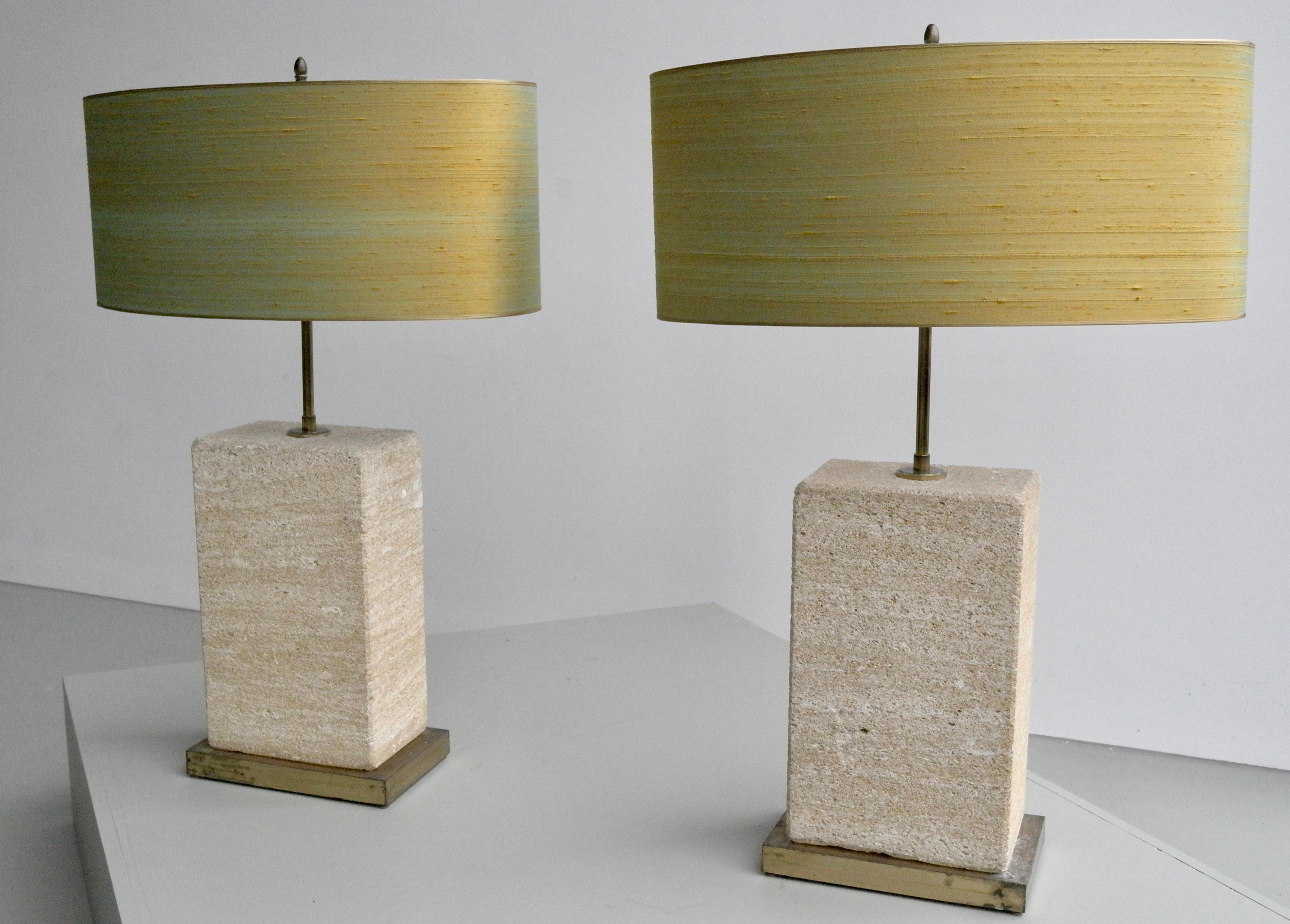 Pair of extra large sandstone, brass and silk table lamps by Roger Vanhevel.
The shades from the pair are newly upholstered in gold/yellow thread silk. Very large and heavy pieces, these lights are dimmable and adjustable in height.